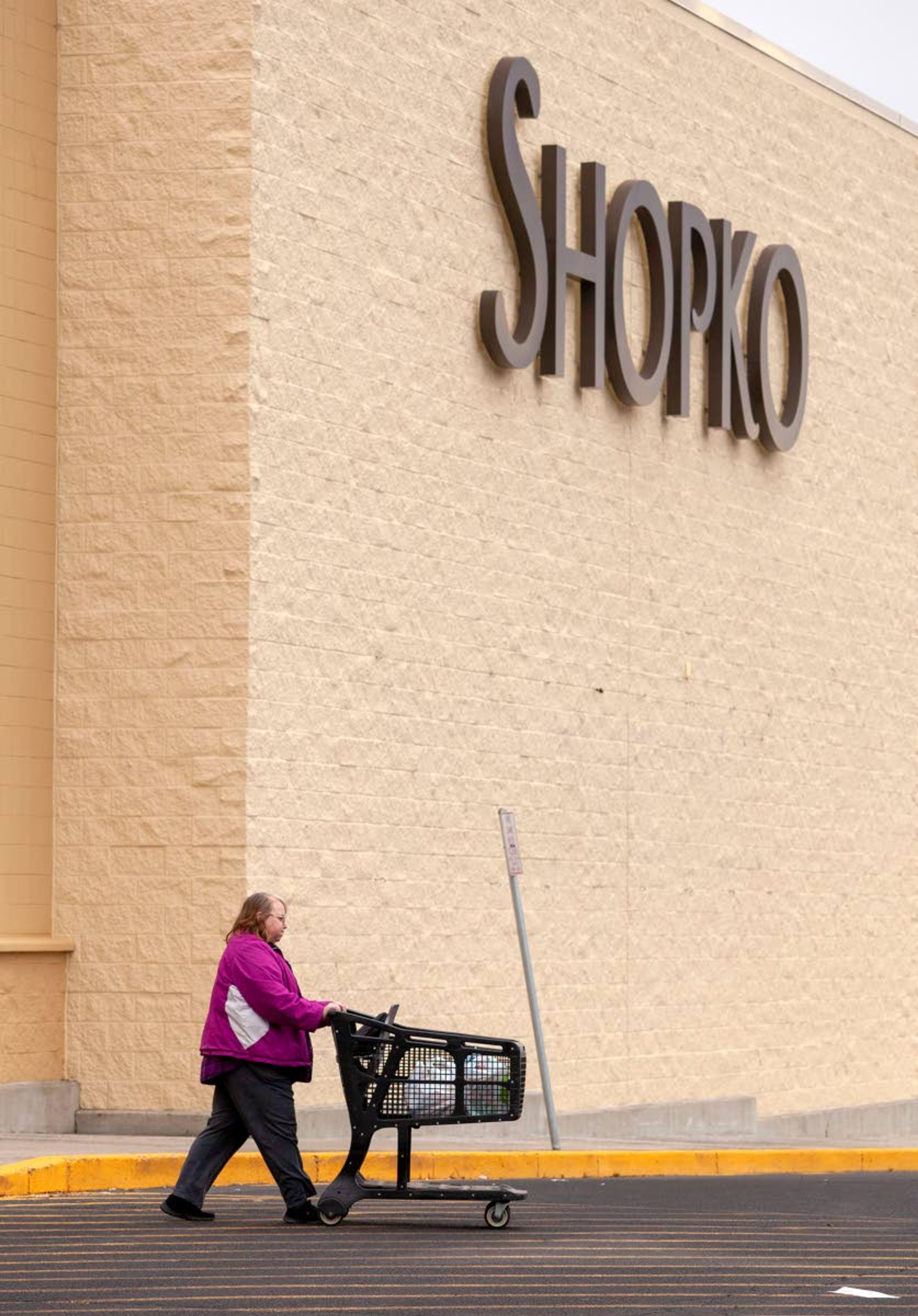 A customer walks outside the Pullman Shopko before the store closed in April. The building has stayed vacant since Shopko closed.