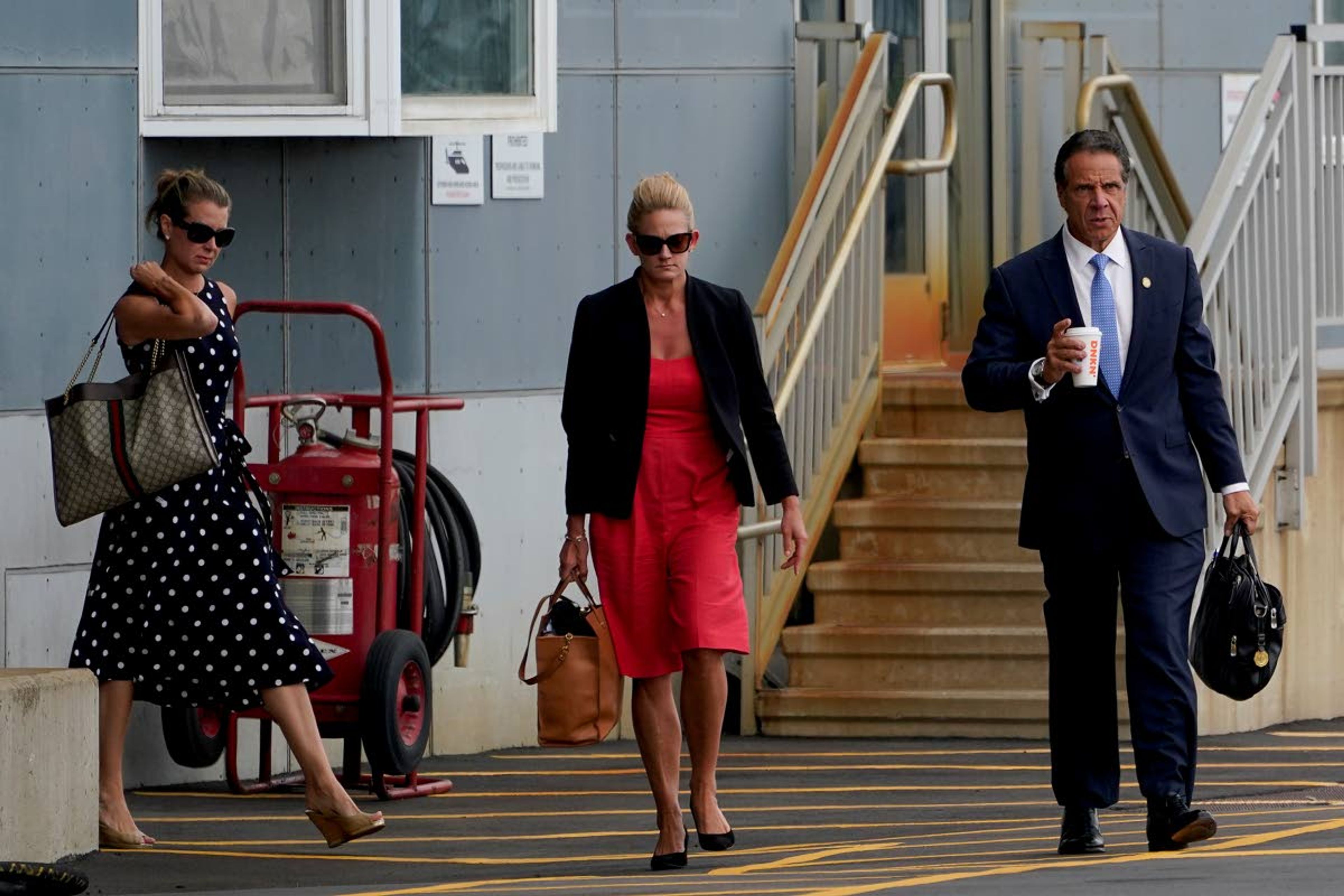 New York Gov. Andrew Cuomo prepares to board a helicopter after announcing his resignation, Tuesday, Aug. 10, 2021, in New York. Cuomo says he will resign over a barrage of sexual harassment allegations. The three-term Democratic governor's decision, which will take effect in two weeks, was announced Tuesday as momentum built in the Legislature to remove him by impeachment. (AP Photo/Seth Wenig)