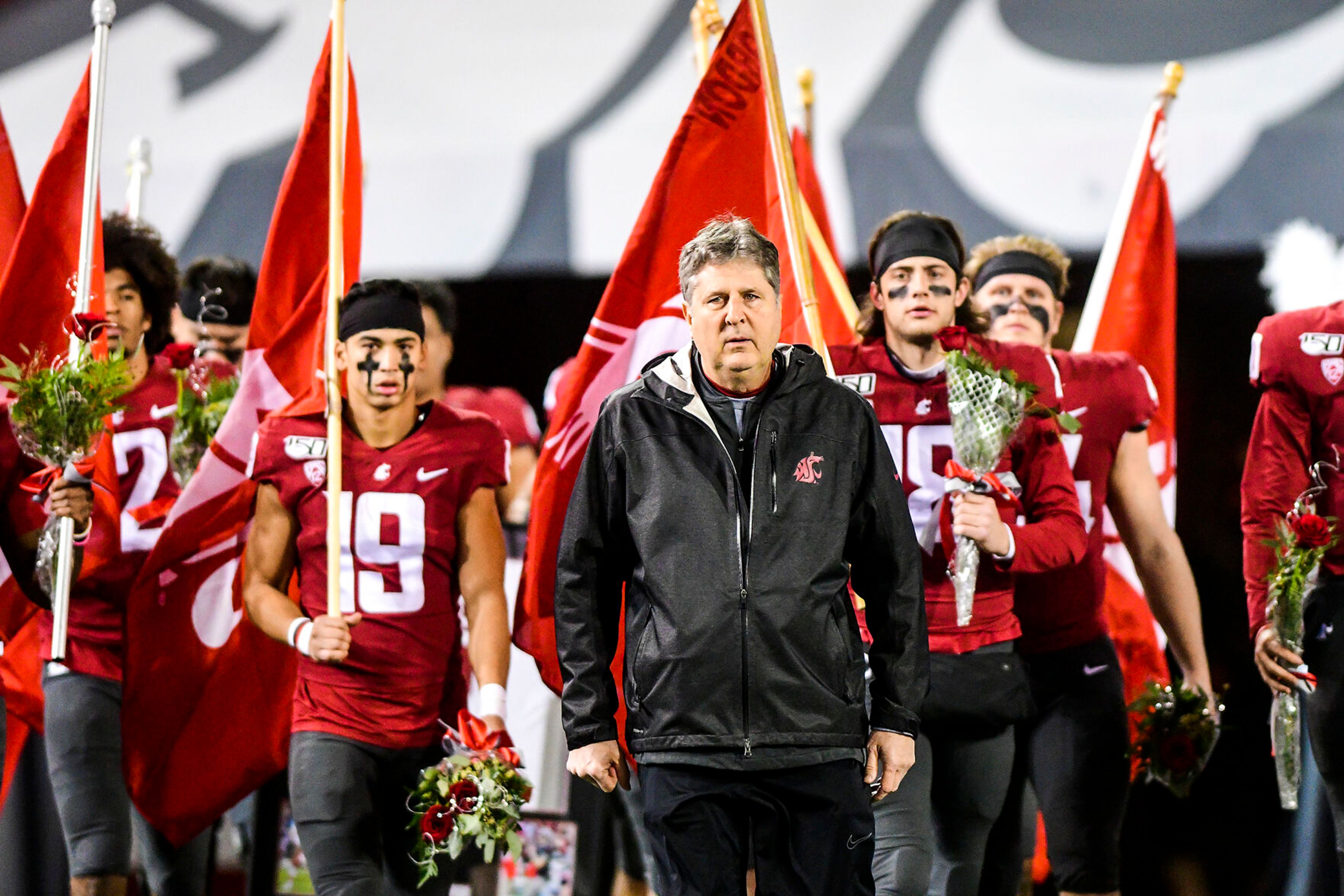 Former Washington State football coach Mike Leach leads the senior class of Cougars out of the tunnel prior to the team’s final home game in 2019 at Gesa Field in Pullman.