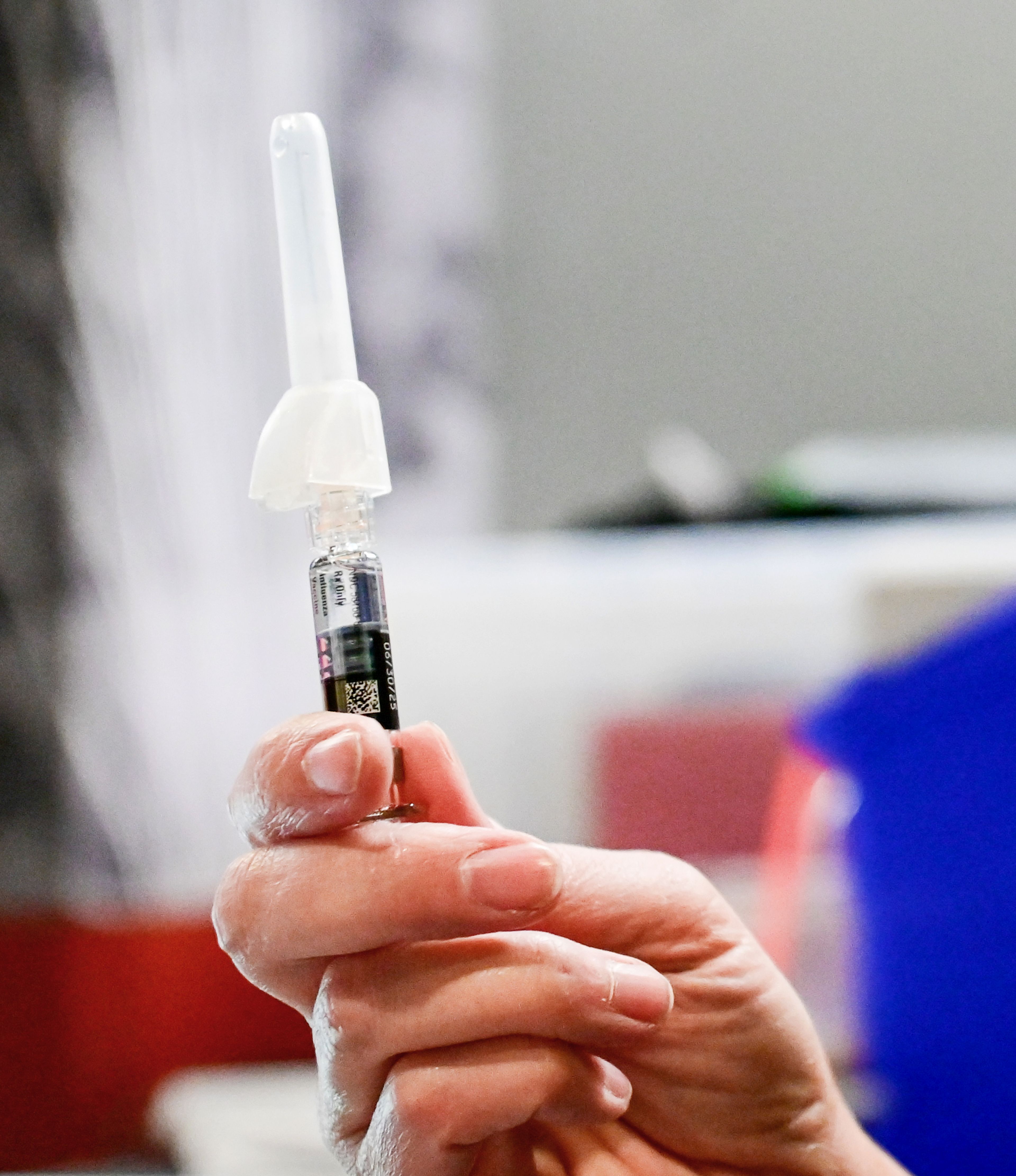 Flu vaccines are prepared Friday by Chris Boyd, manager of Nursing Services at Cougar Health Services, at the first Flu Shot Friday clinic on Washington State University campus in Pullman.