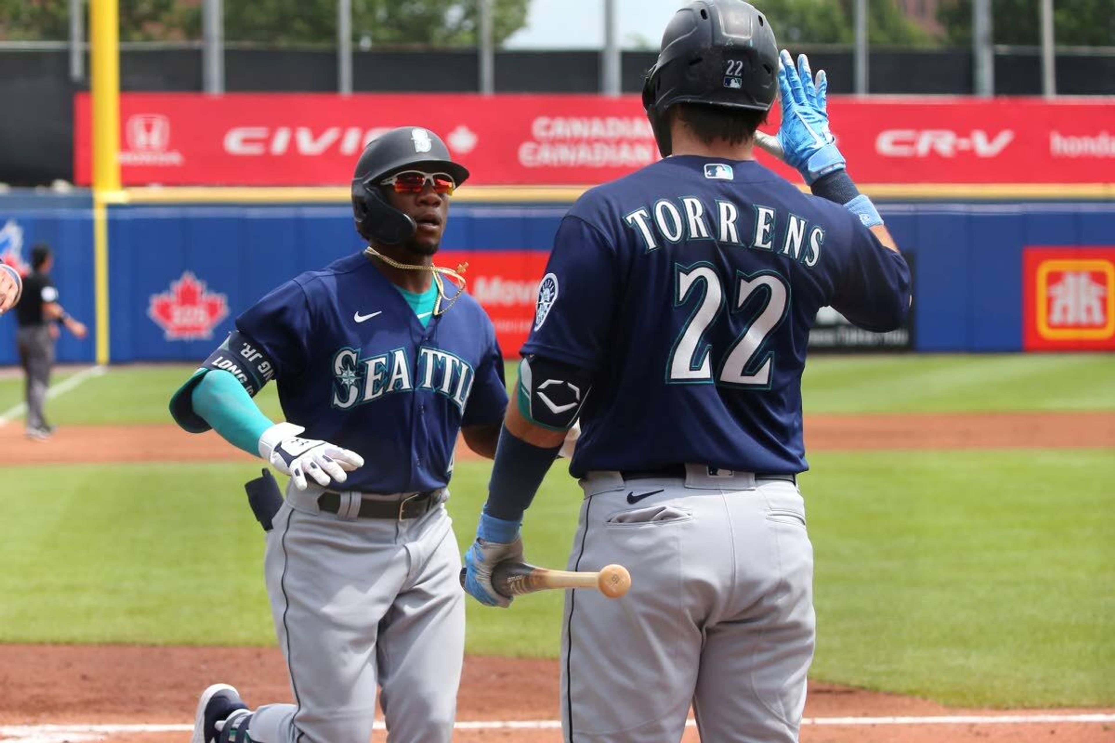 Seattle Mariners Shed Long Jr. celebrates his two-run home run with Luis Torrens during the third inning of a baseball game against the Toronto Blue Jays, Thursday, July 1, 2021, in Buffalo, N.Y. (AP Photo/Jeffrey T. Barnes)