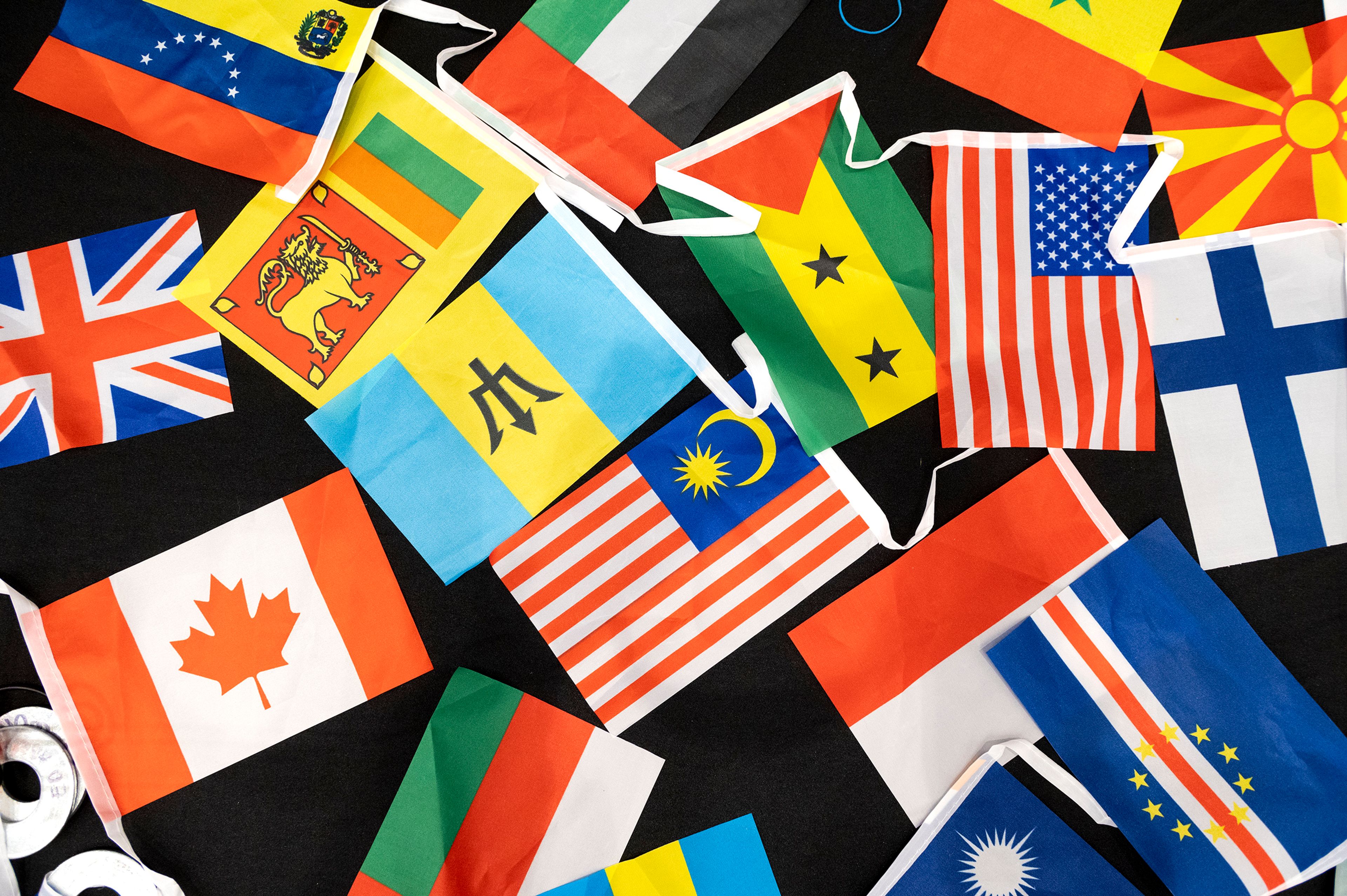 Various national flags are laid out on a table Friday at Pullman High School’s multicultural night.