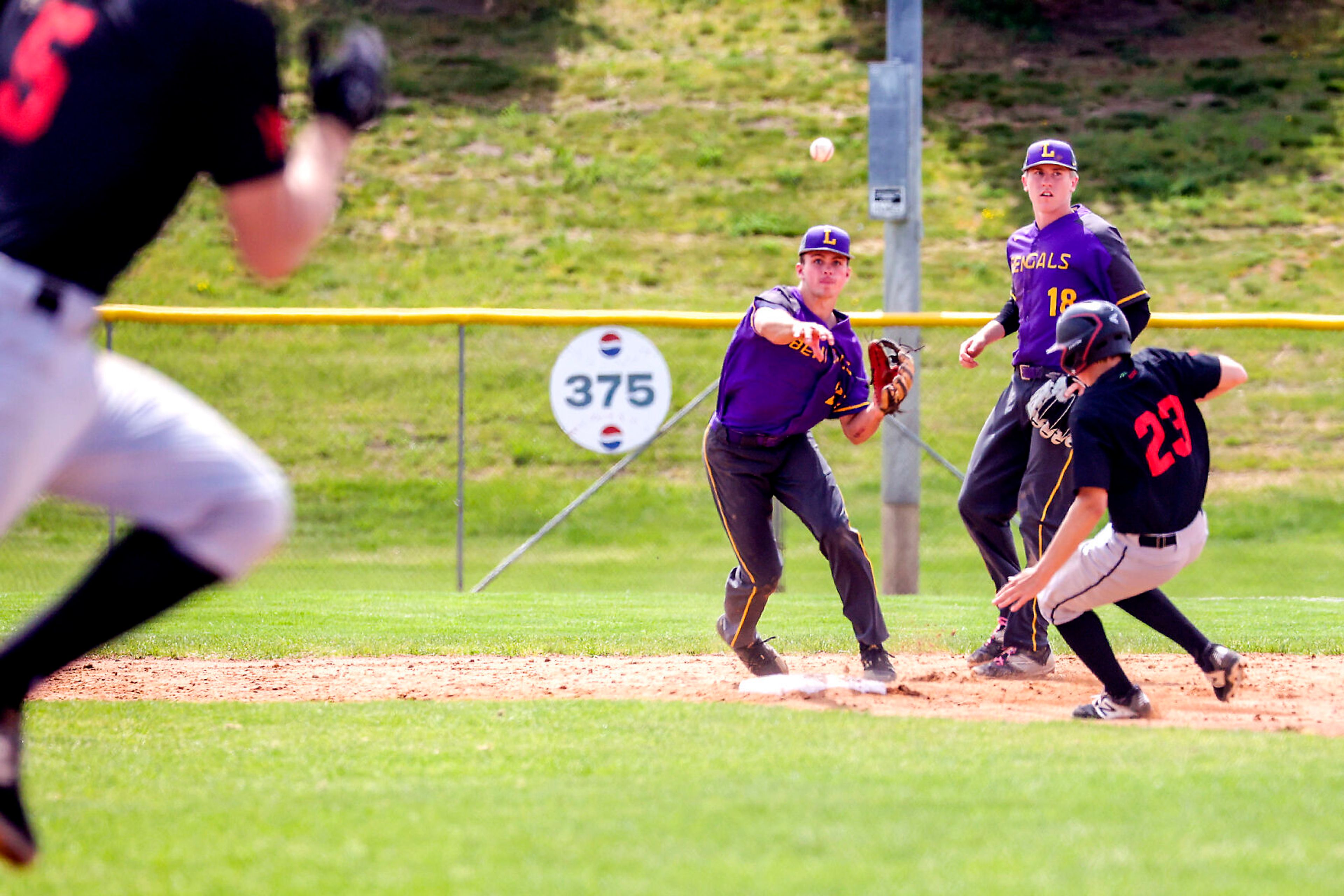 Lewiston’s Cruz Hepburn throws to first base on a grounder off the bat of Barrett Abendroth at Church Field on Saturday. Lewiston defeated Moscow 6-4.