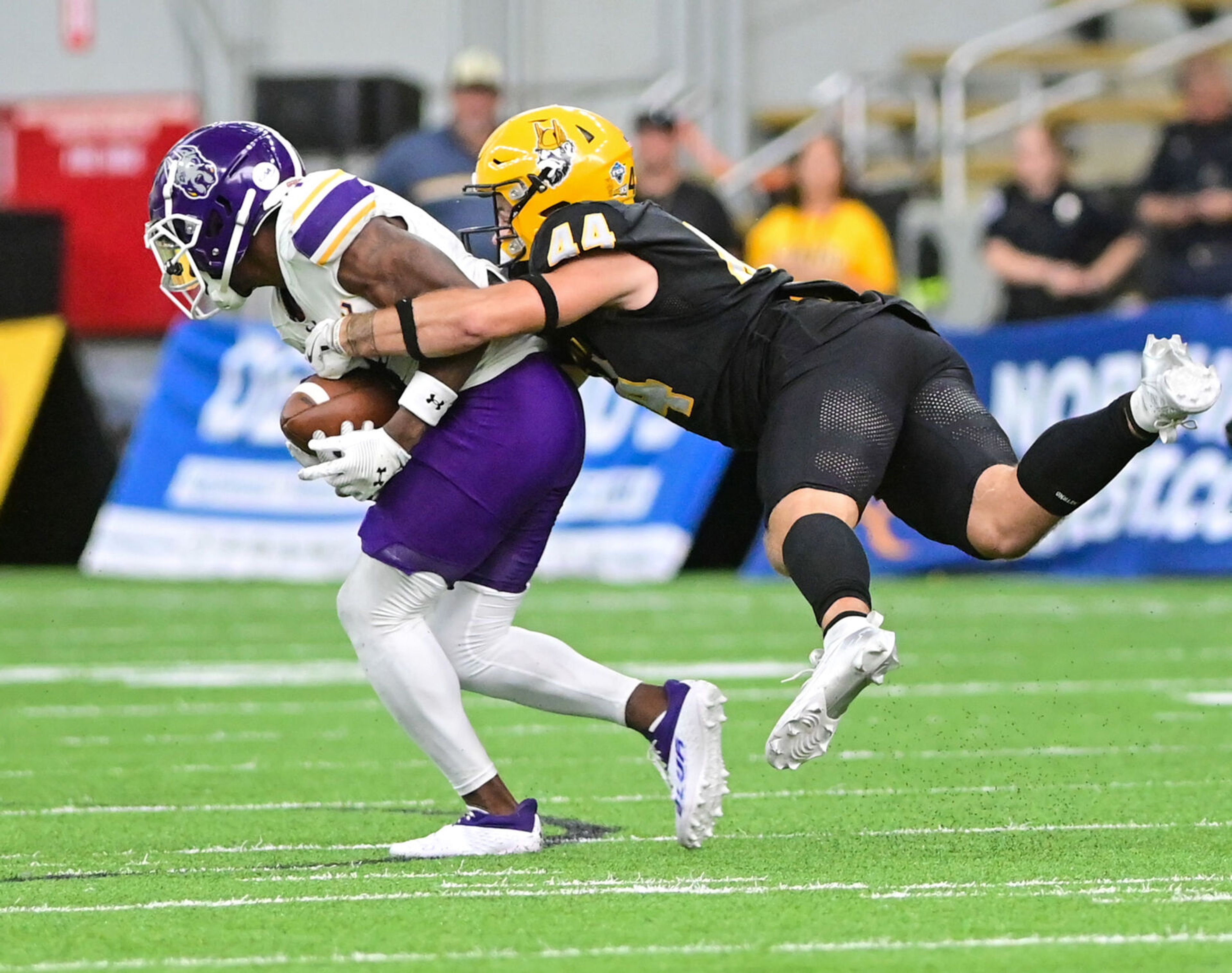 Idaho Vandals linebacker Cruz Hepburn attempts to tackle UAlbany wide receiver Seven McGee Saturday at the P1FCU Kibbie Dome in Moscow.