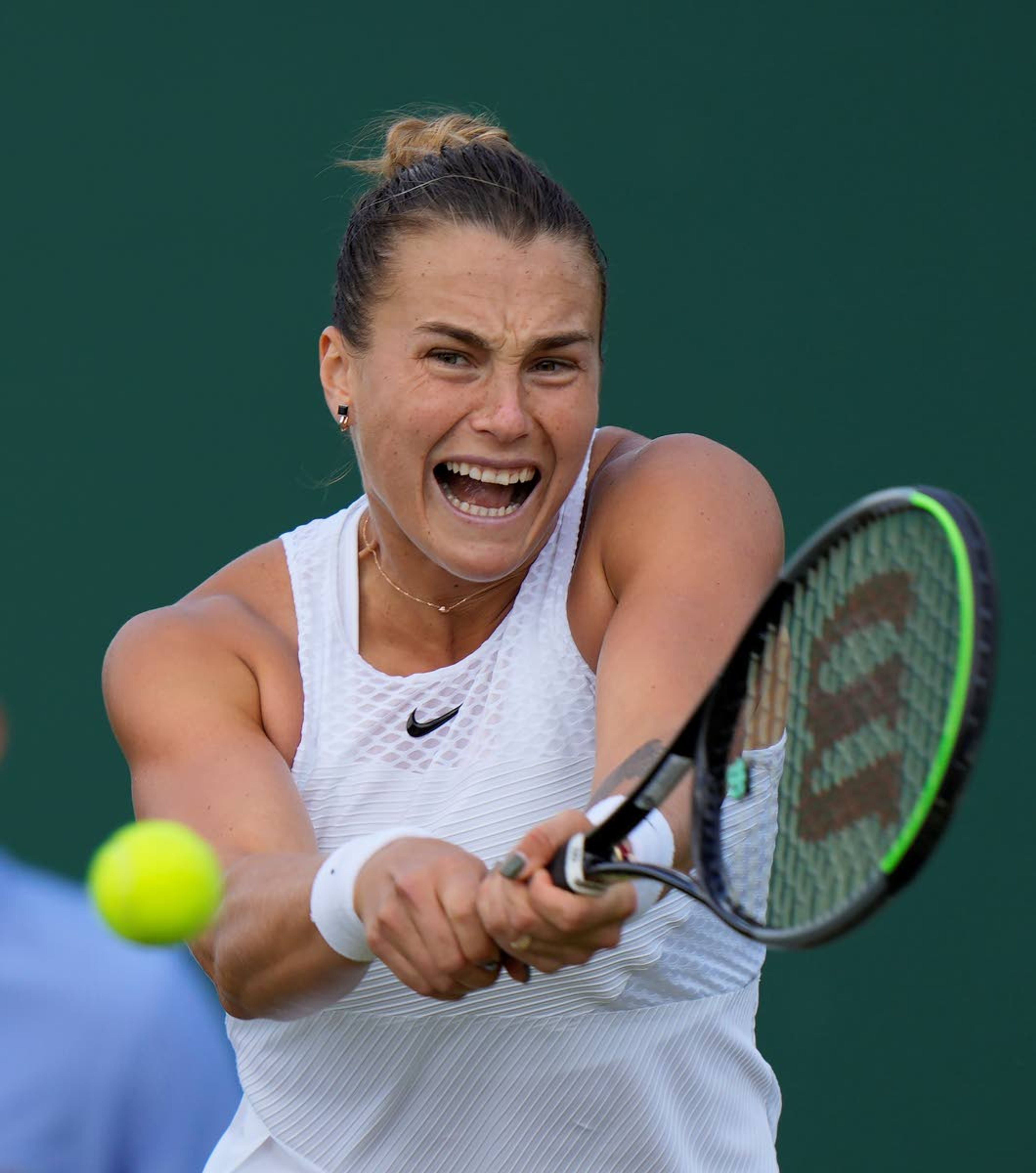 Aryna Sabalenka of Belarus plays a return to Kazakhstan's Elena Rybakina during the women's singles fourth round match on day seven of the Wimbledon Tennis Championships in London, Monday, July 5, 2021. (AP Photo/Alastair Grant)