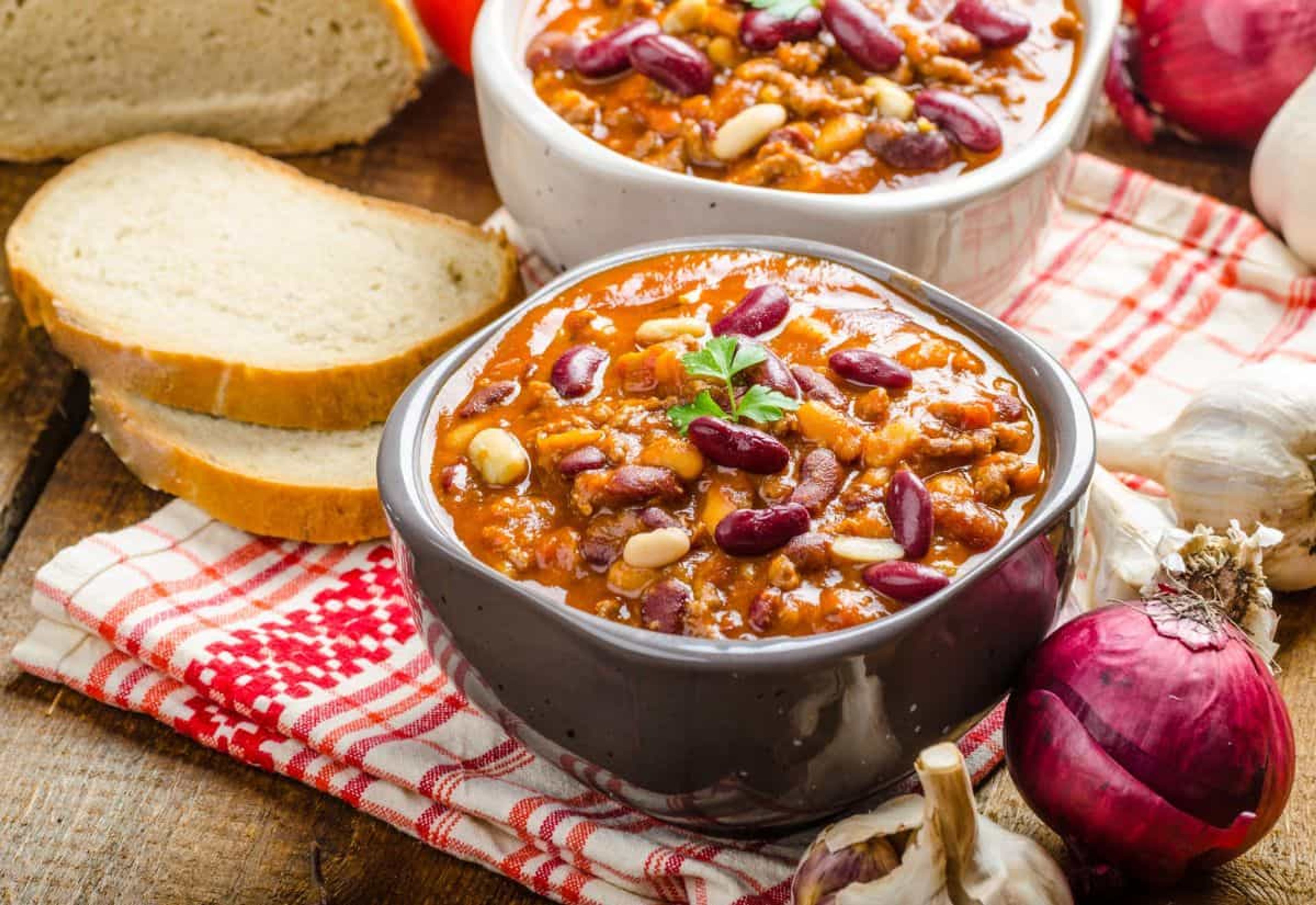 Feeling the autumn chill? Warm up with October's National Chili Month-celebrating bowls packed with flavor, spice and comfort. Photo credit: Depositphotos.