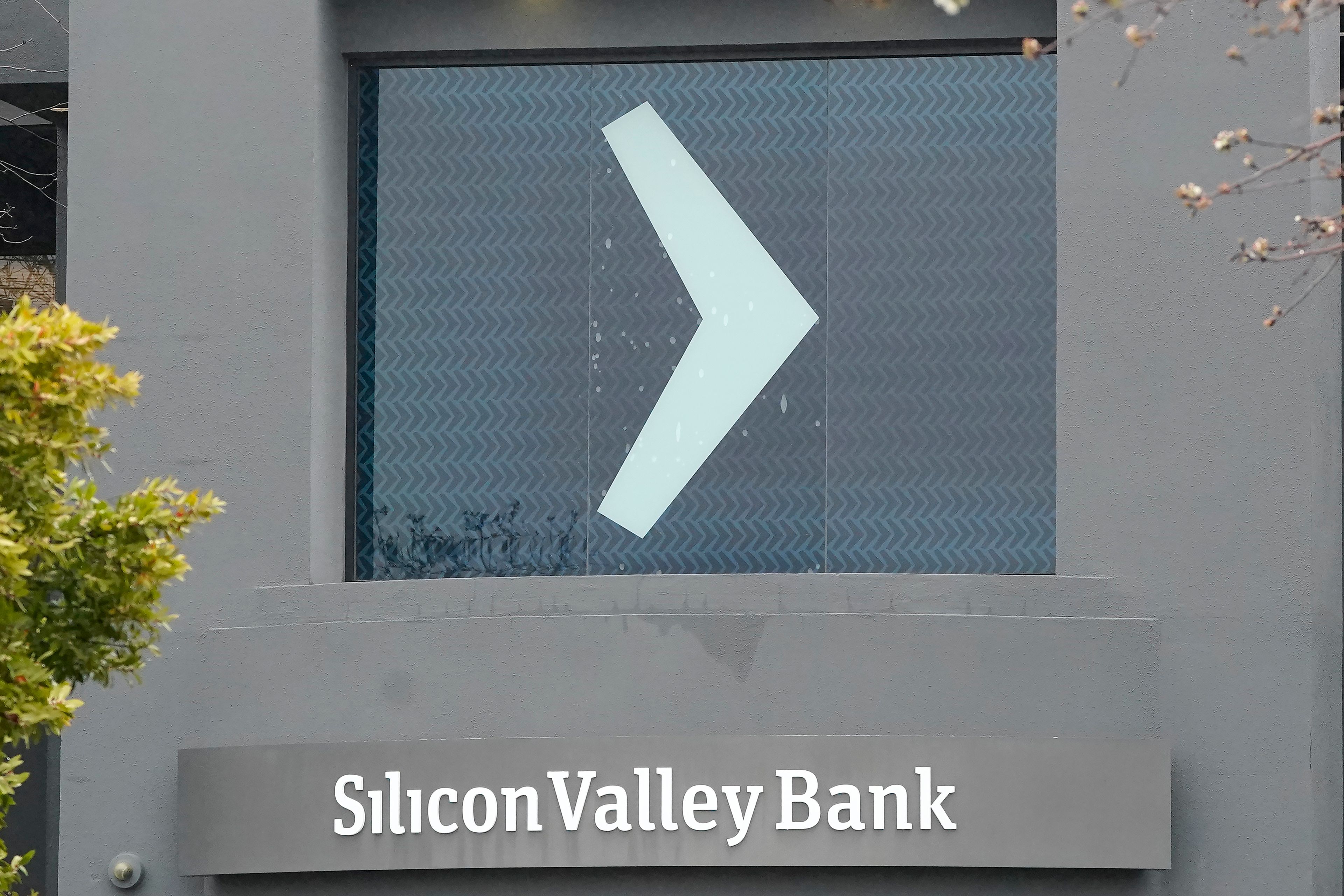 A Silicon Valley Bank sign is shown at the company's office in Santa Clara, Calif., Friday, March 10, 2023. The Federal Deposit Insurance Corporation is seizing the assets of Silicon Valley Bank, marking the largest bank failure since Washington Mutual during the height of the 2008 financial crisis. The FDIC ordered the closure of Silicon Valley Bank and immediately took position of all deposits at the bank Friday. (AP Photo/Jeff Chiu)