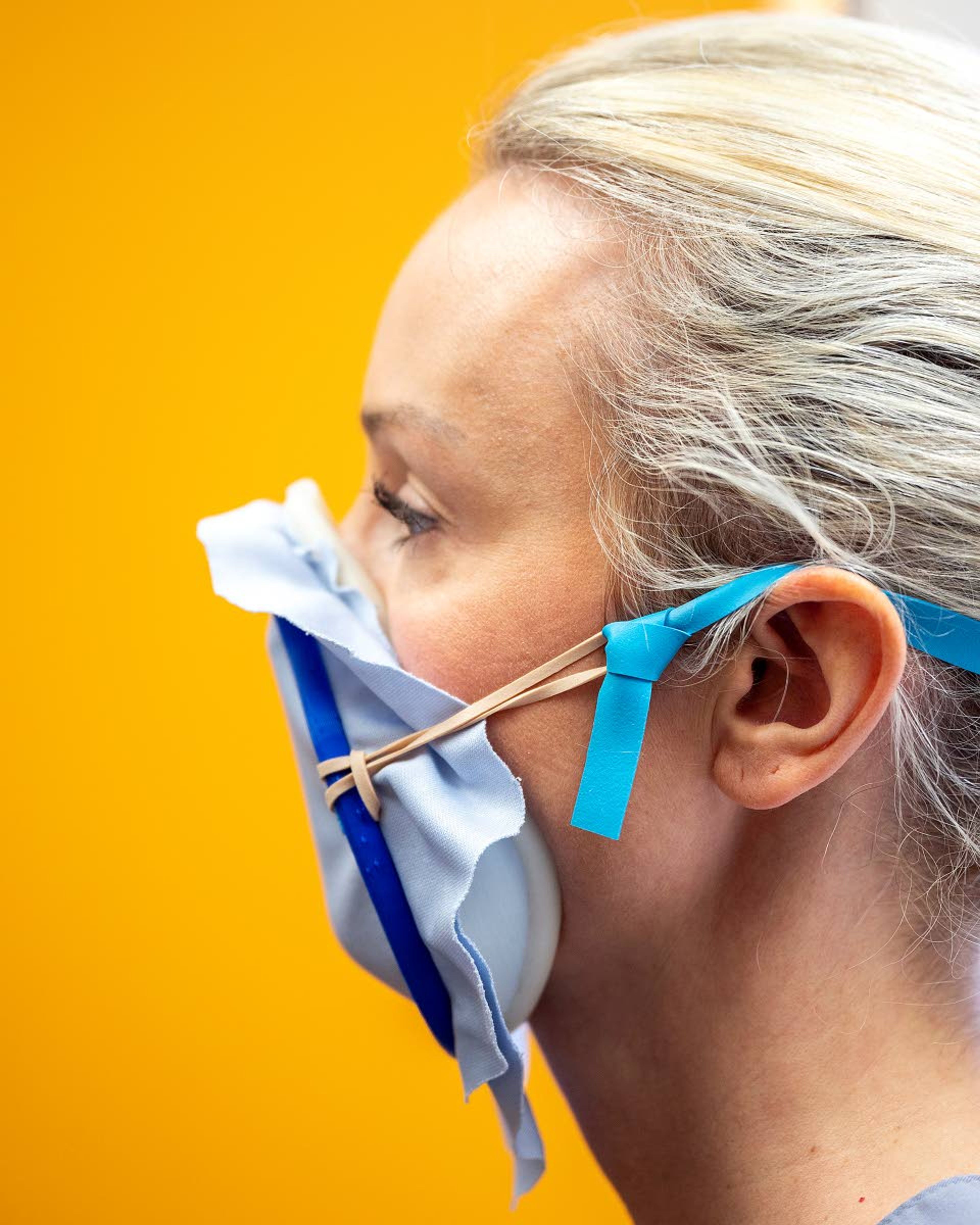 Darby Justis tries on an experimental mask that was provided by the University of Idaho School of Engineering on Wednesday at Valley Medical Center in Lewiston.