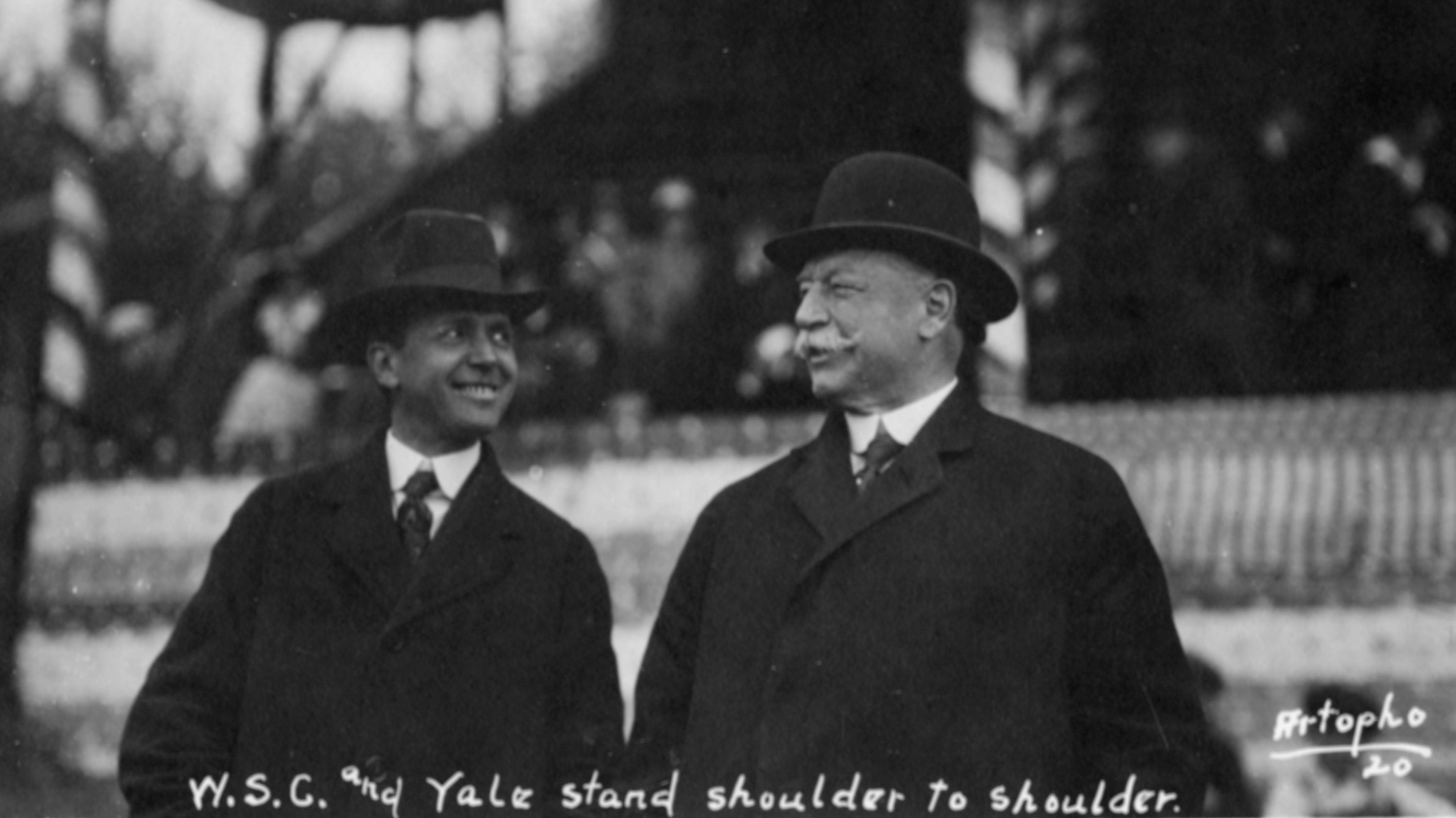 Washington State College President E.O. Holland, left, stands beside former U.S. President William Taft on Rogers Field.