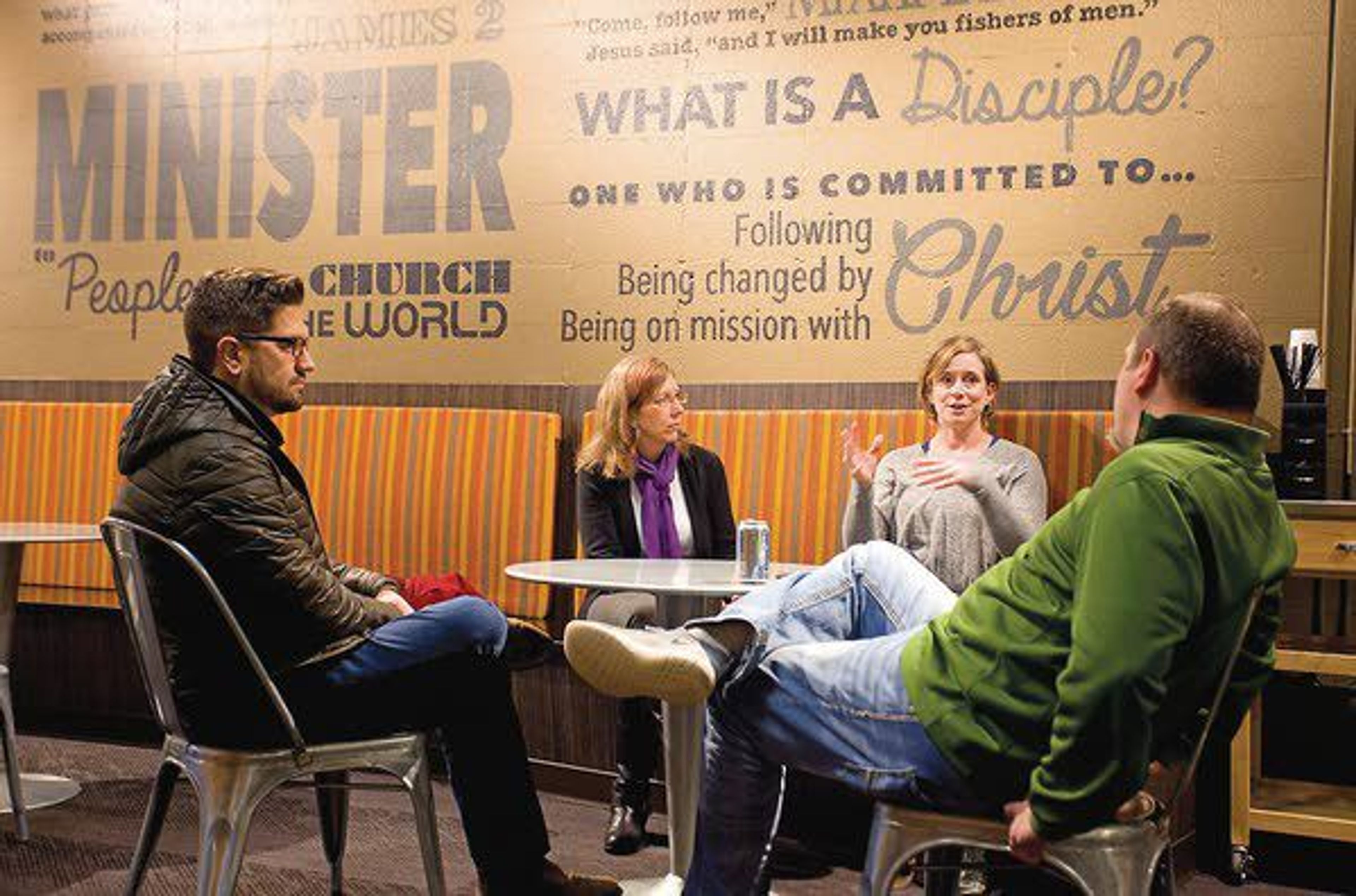 Peter Roise (left to right), Shari Hall and Claire Roise talk with Senior Pastor Aaron Couch at Real Life on the Palouse on Thursday in Moscow.