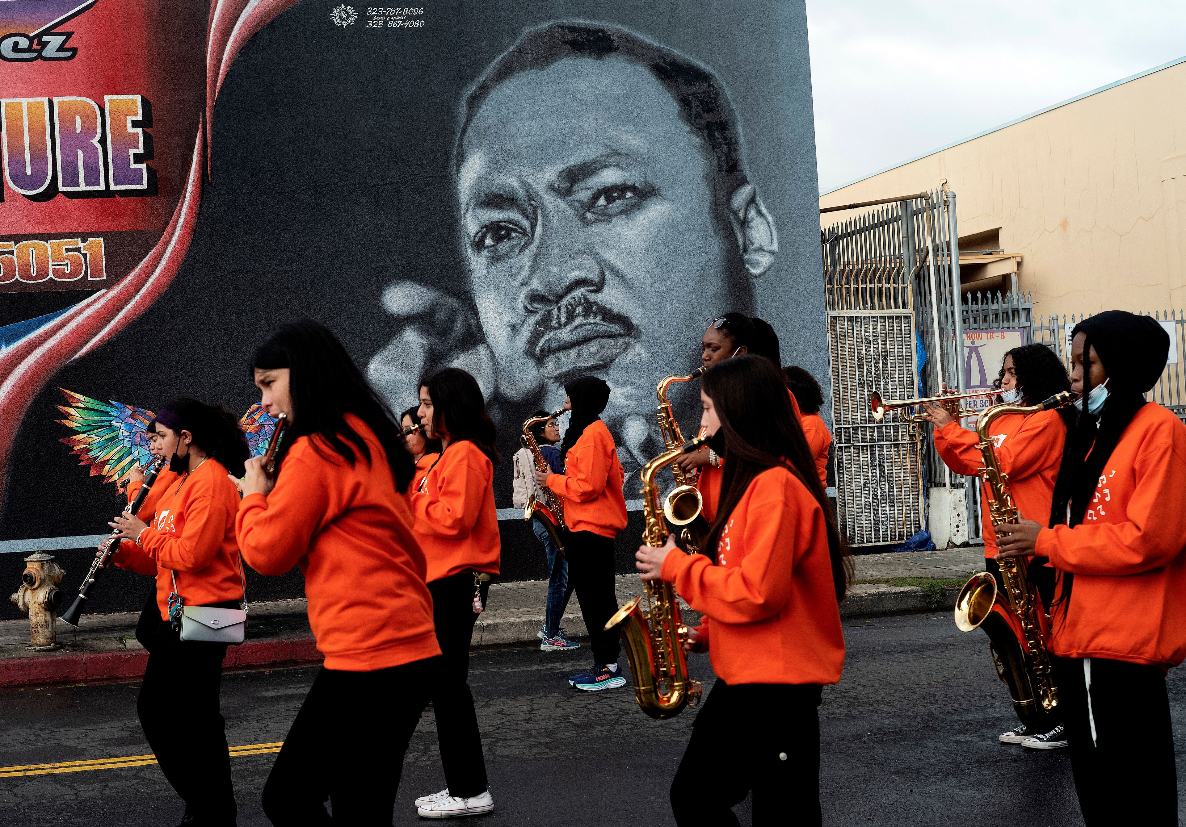 Music students from the Kipp Scholar Academy prepare to participate in the Kingdom Day Parade in Los Angeles, Monday, Jan. 16, 2023. After a two-year hiatus because of the COVID-19 pandemic, the parade, America's largest Martin Luther King Day celebration, returned. (AP Photo/Richard Vogel)