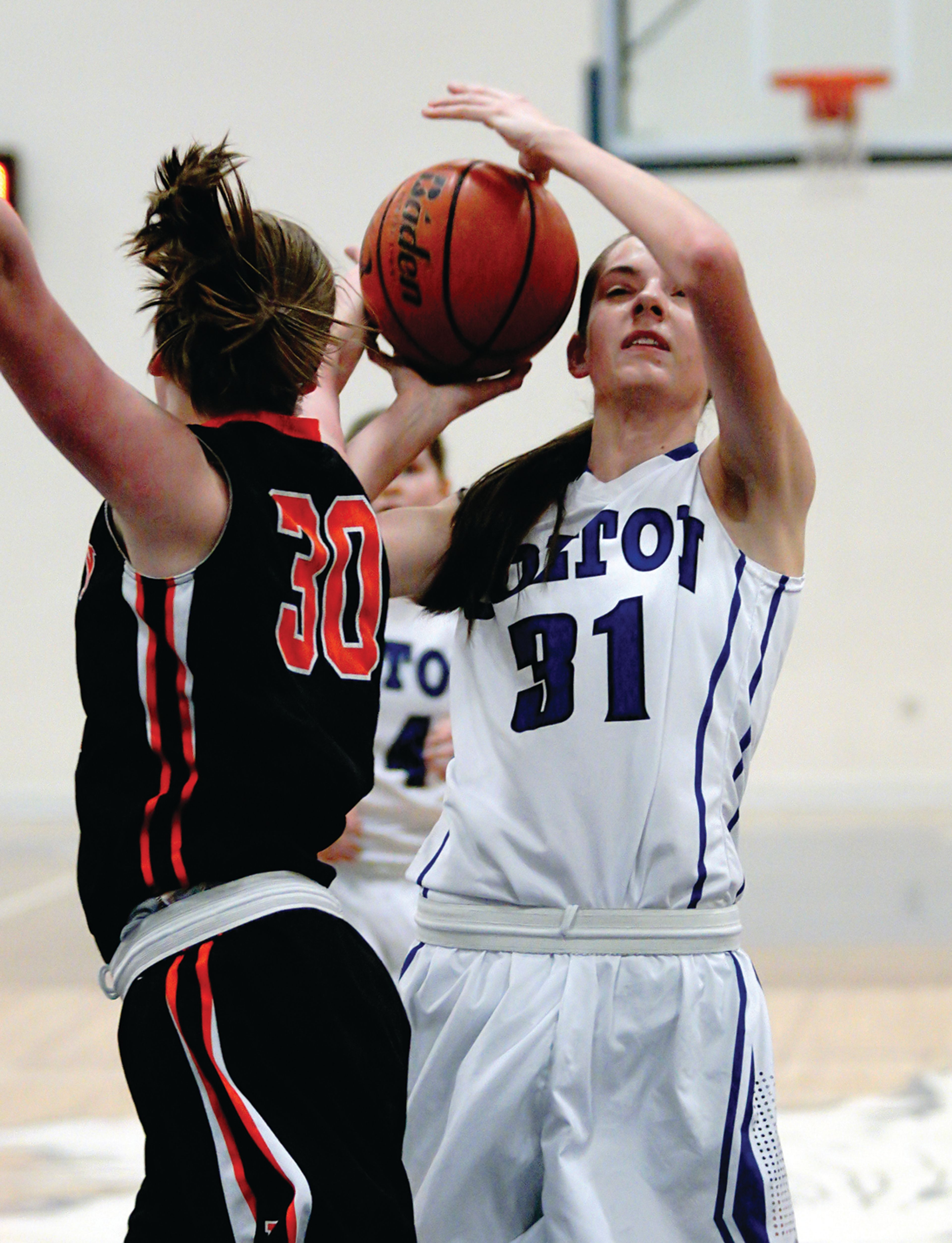 Colton's Emily Schultheis (31) is fouled by Pomeroy's Maddy Dixon in the first quarter of a game at Colton on Friday night.