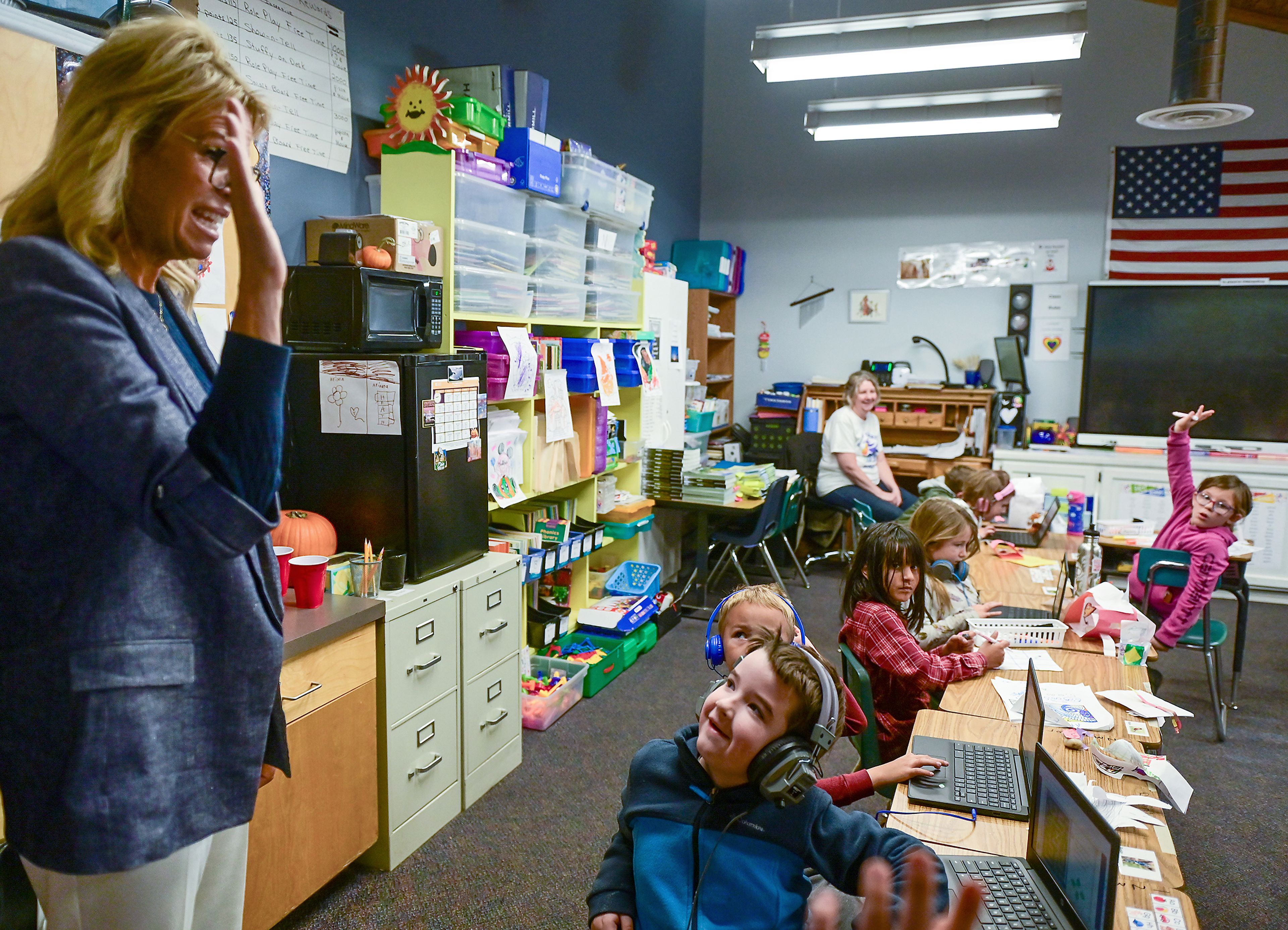 Moscow Charter School first graders respond to a question from Idaho Superintendent of Public Instruction Debbie Critchfield, left, during Critchfields tour of the school Friday in Moscow.