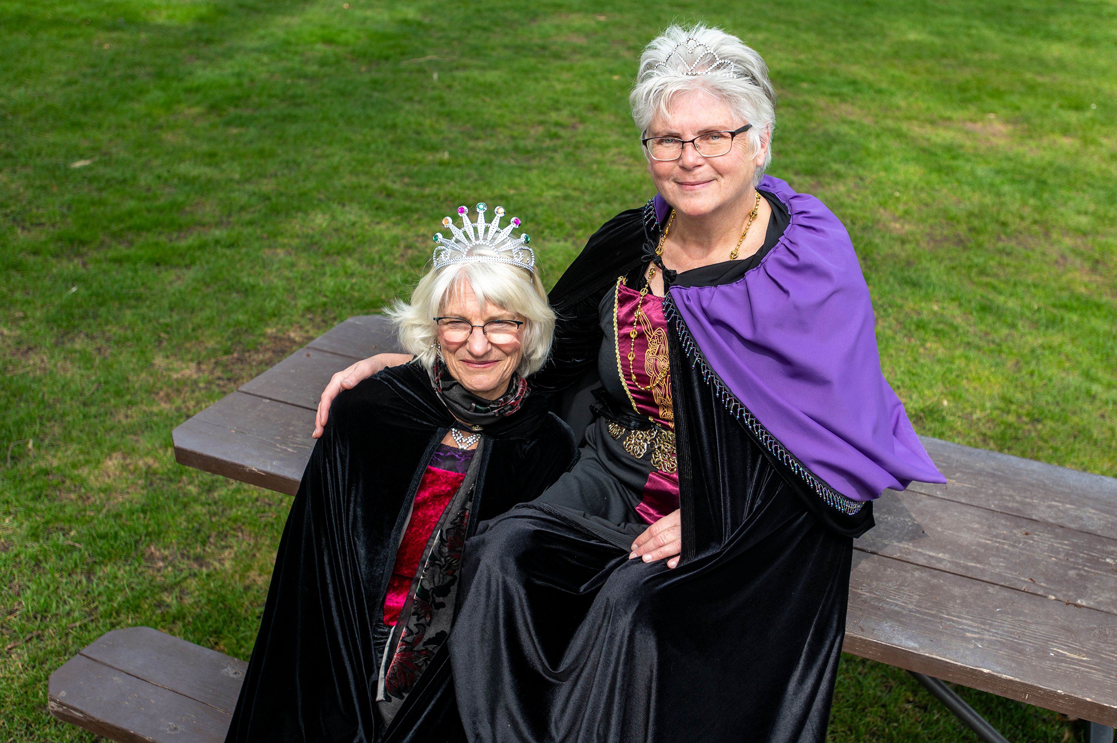 Theresa Beaver, left, and Rebecca Rod pose for a photo at East City Park while dressed in their royal attire as queens of this weekend’s Renaissance Fair in Moscow.