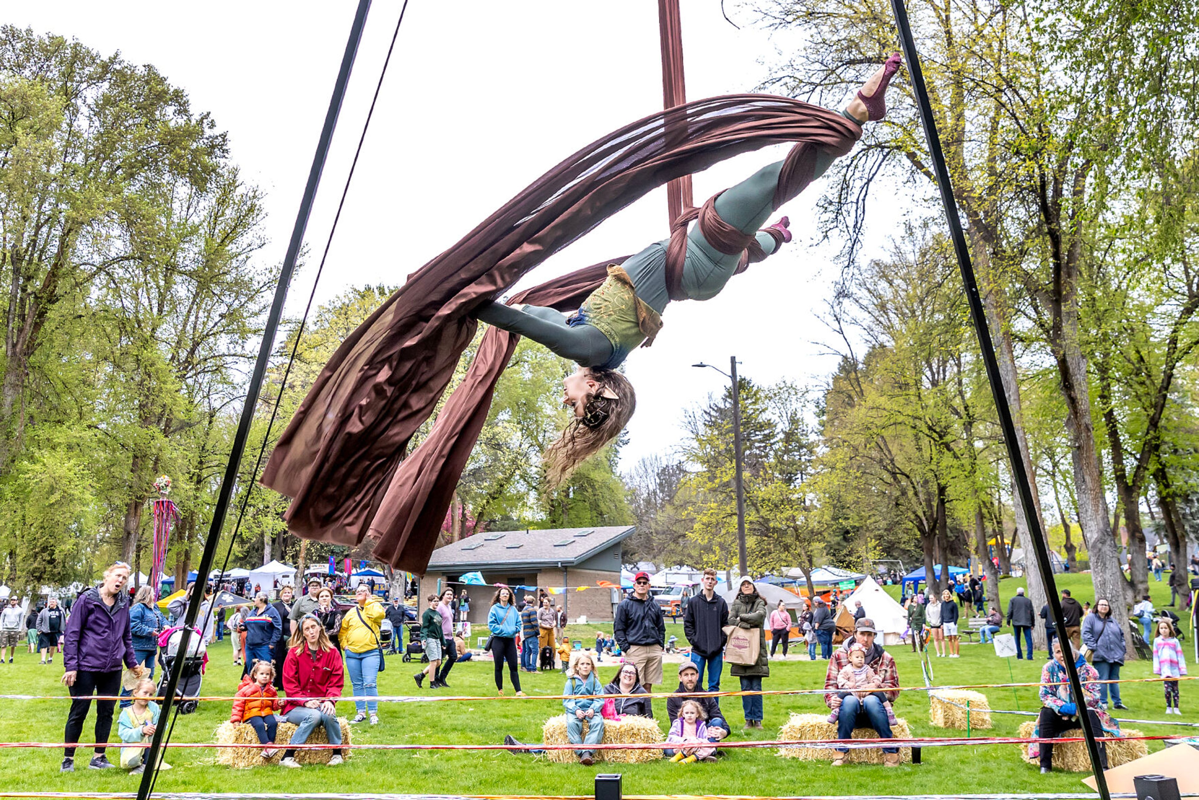 Shelby McCahon, of Moscow, with Gem State Flyers, performs aerial moves at the Moscow Renaissance Fair Saturday at East City Park in Moscow.