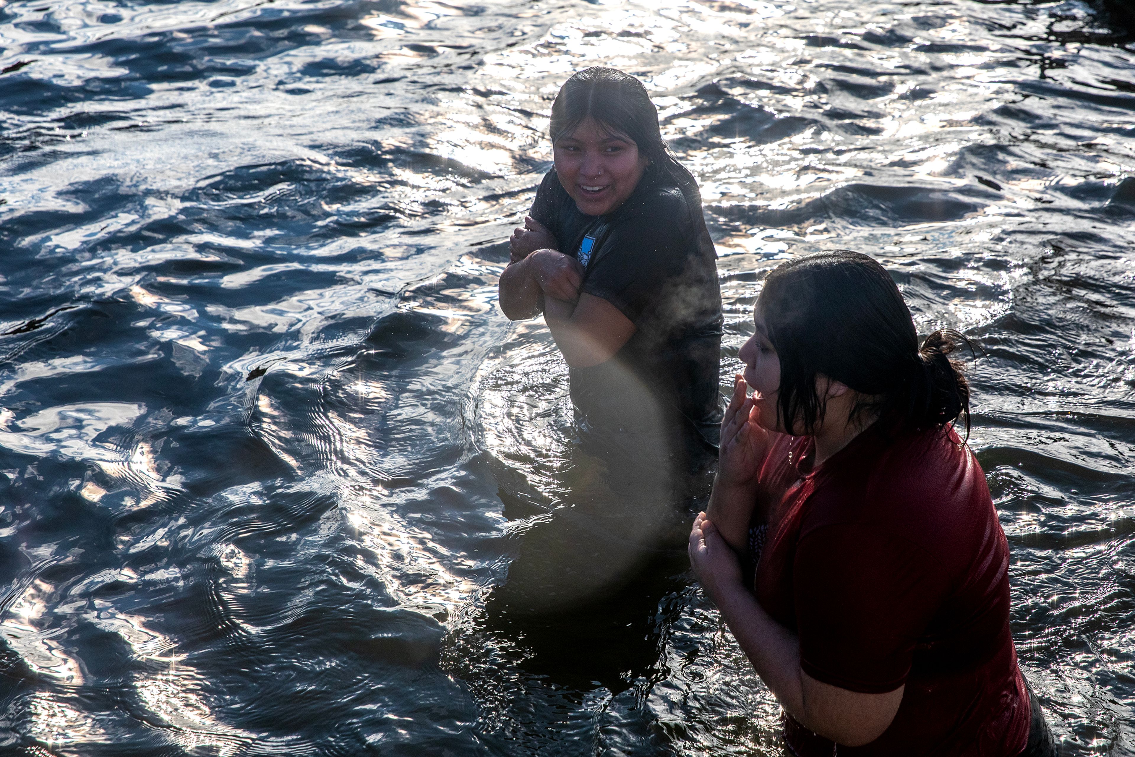 People emerge from the Snake River shivering Monday in Clarkston.