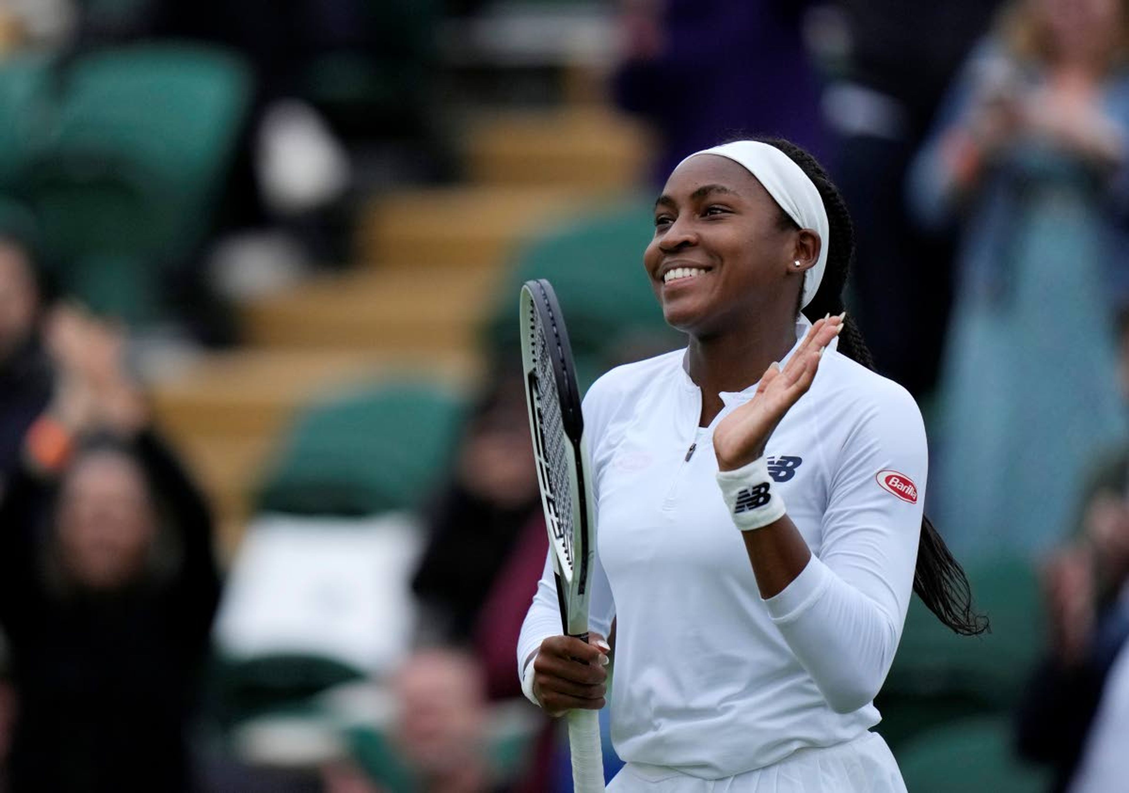 Coco Gauff of the US celebrates winning the women's singles first round match against Britain's Francesca Jones on day two of the Wimbledon Tennis Championships in London, Tuesday June 29, 2021. (AP Photo/Alastair Grant)