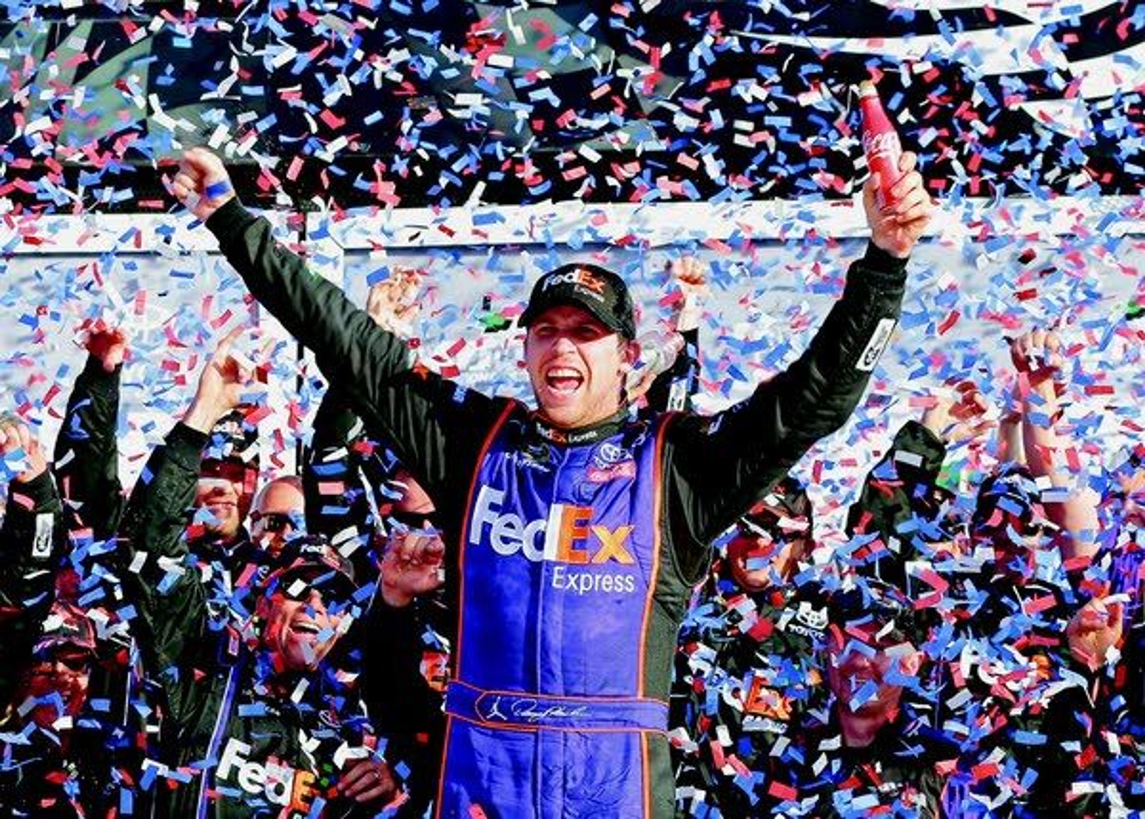 Denny Hamlin celebrates in Victory Lane after winning the Daytona 500 on Sunday at Daytona International Speedway in