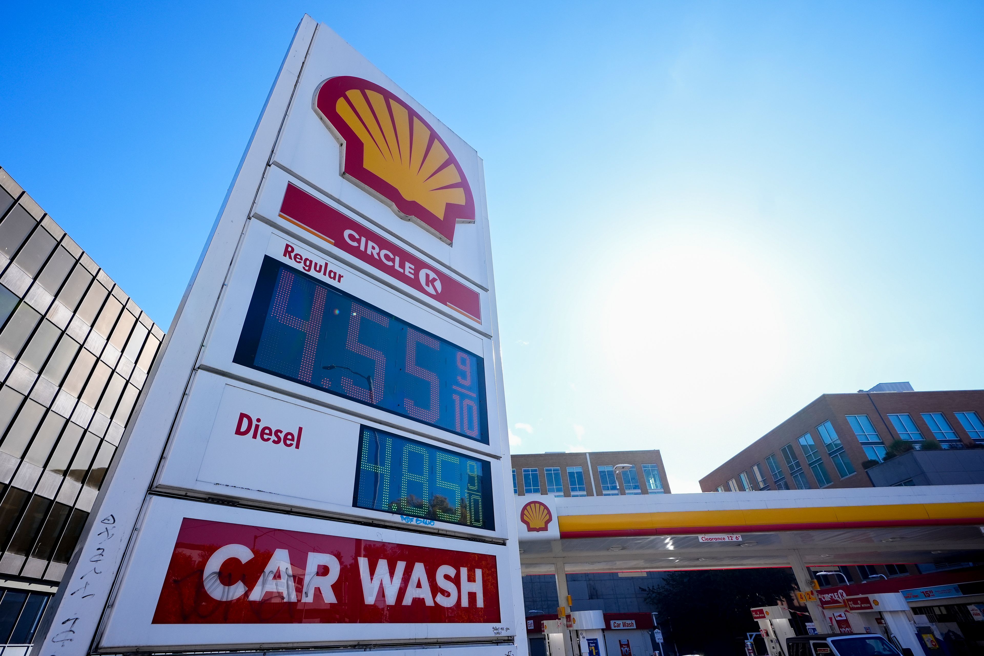 Prices are displayed on a corner sign at a Shell gas station, Wednesday, Oct. 9, 2024, in Seattle. (AP Photo/Lindsey Wasson)