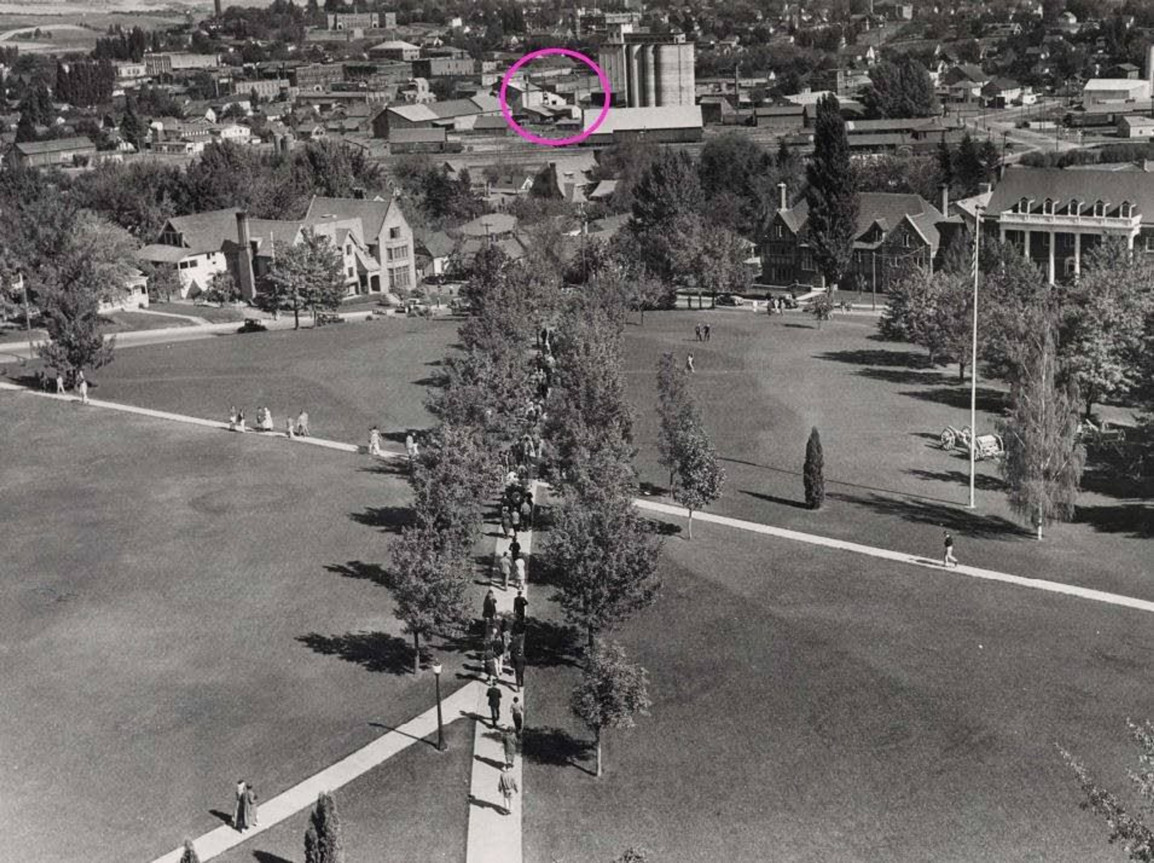 University of Idaho Library Special Collections and ArchivesA 1934 image shows the University of Idaho’s Hello Walk, foreground, looking northeast, with the corner of Sixth and Jackson street circled.