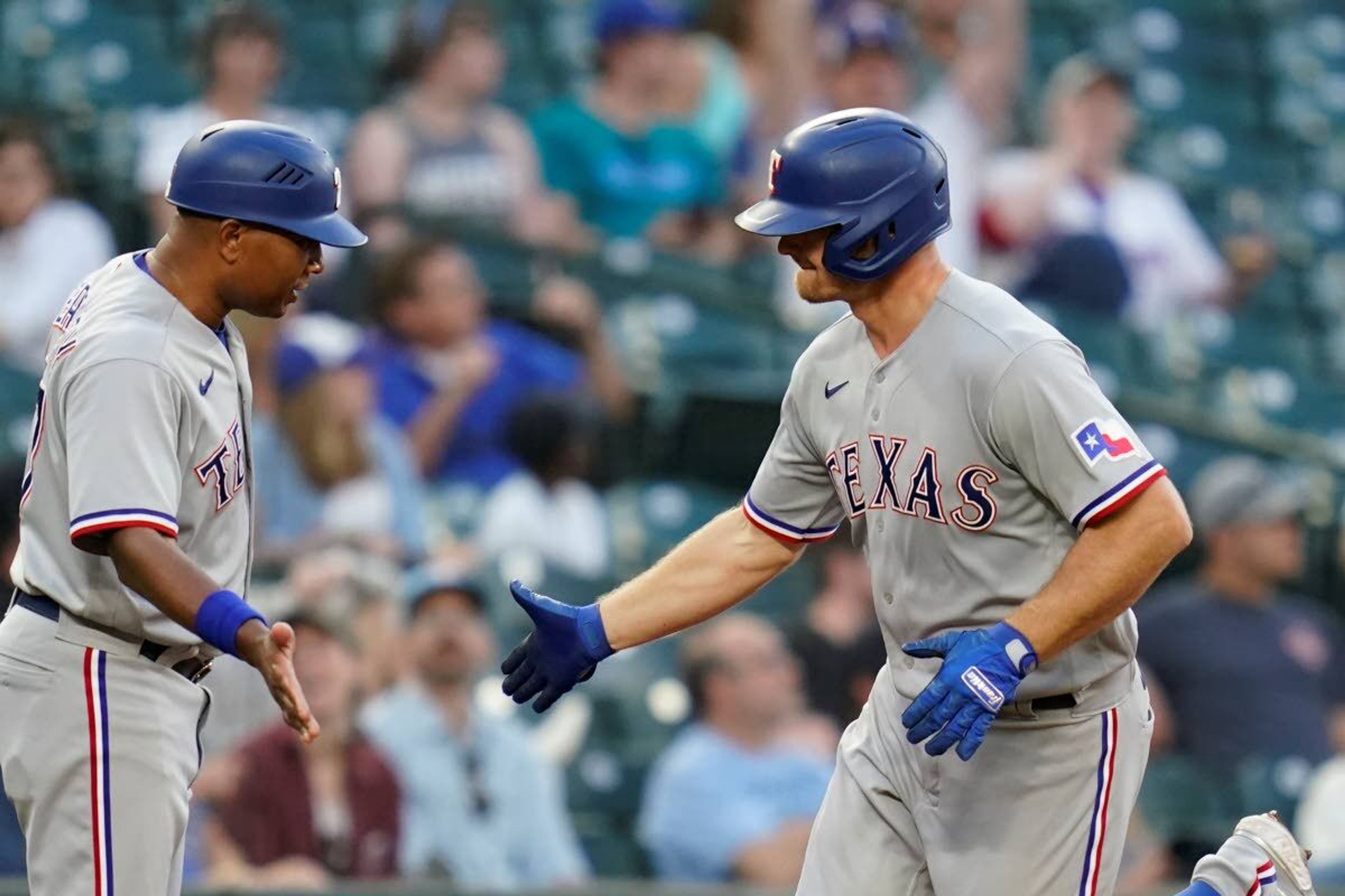 Texas’ John Hicks hit two home runs in Saturday’s win against Seattle.Associated Press