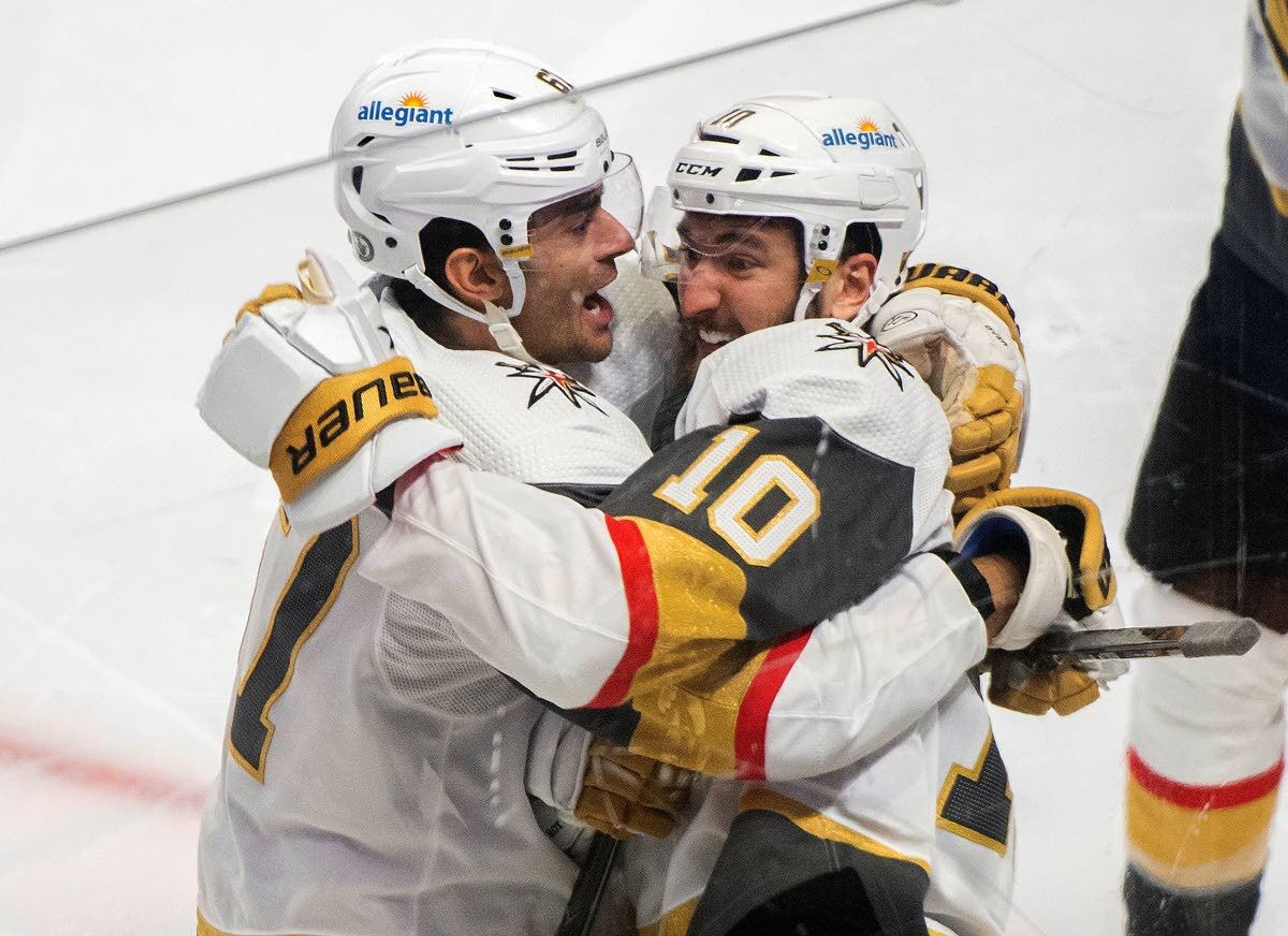 Vegas Golden Knights' Nicolas Roy (10) celebrates his game-winning goal against the Montreal Canadiens with teammate Max Pacioretty in overtime of Game 4 in an NHL Stanley Cup playoff hockey semifinal in Montreal, Sunday, June 20, 2021.