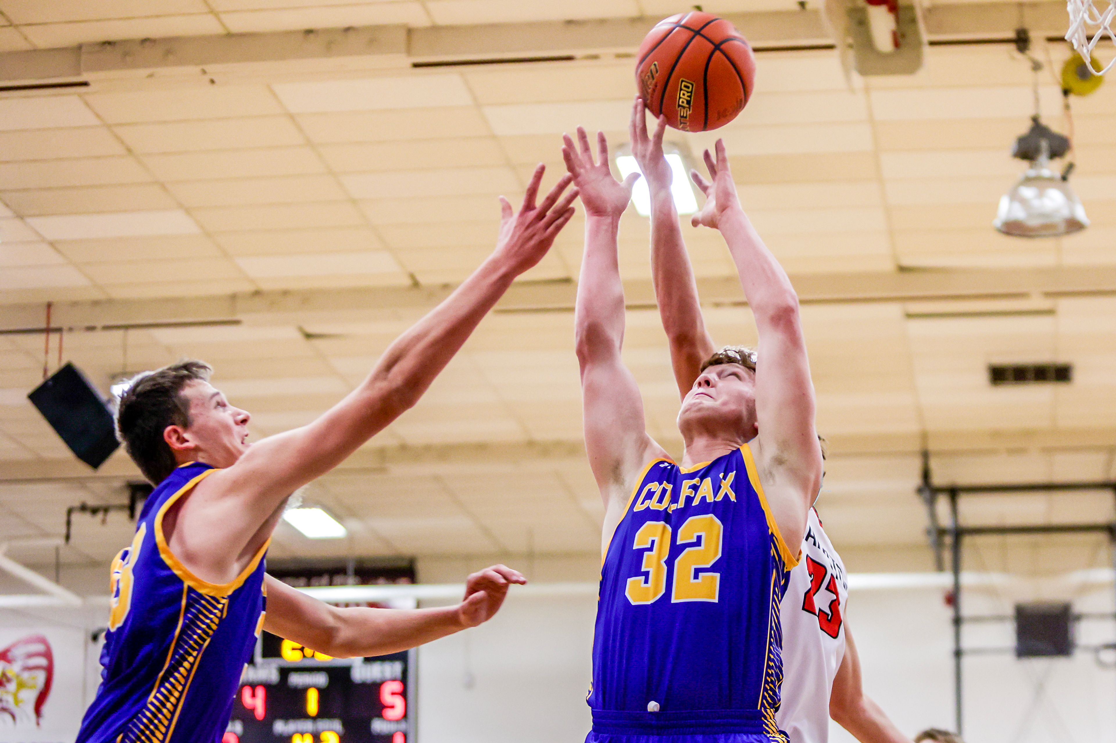 Colfax Mason Gilchrist (32) looks to grab the rebound against Clarkston in a quarter of a nonleague game Thursday at Clarkston.