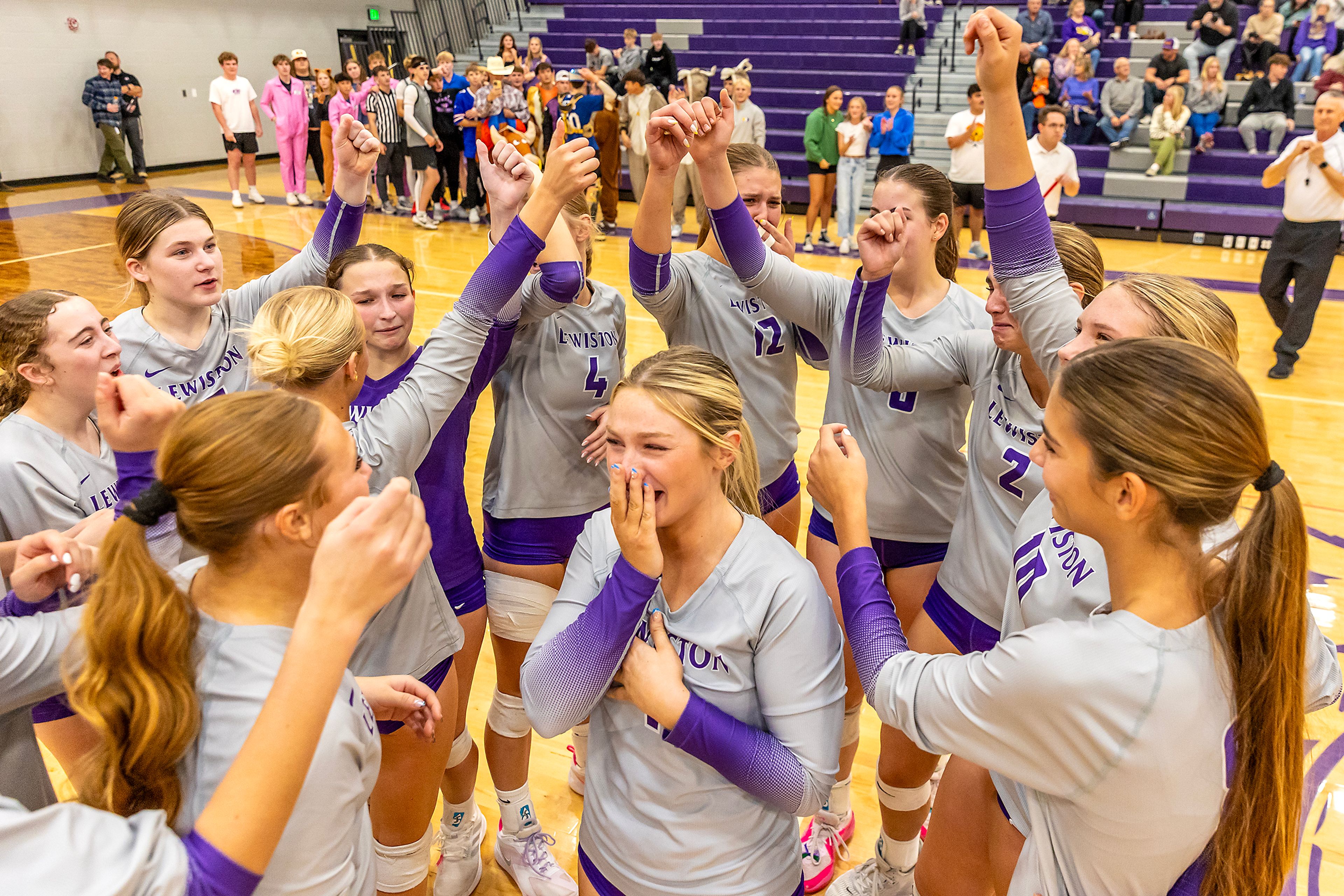 Lewiston celebrates their victory over Moscow in a 5A district tournament match Tuesday in Lewiston.