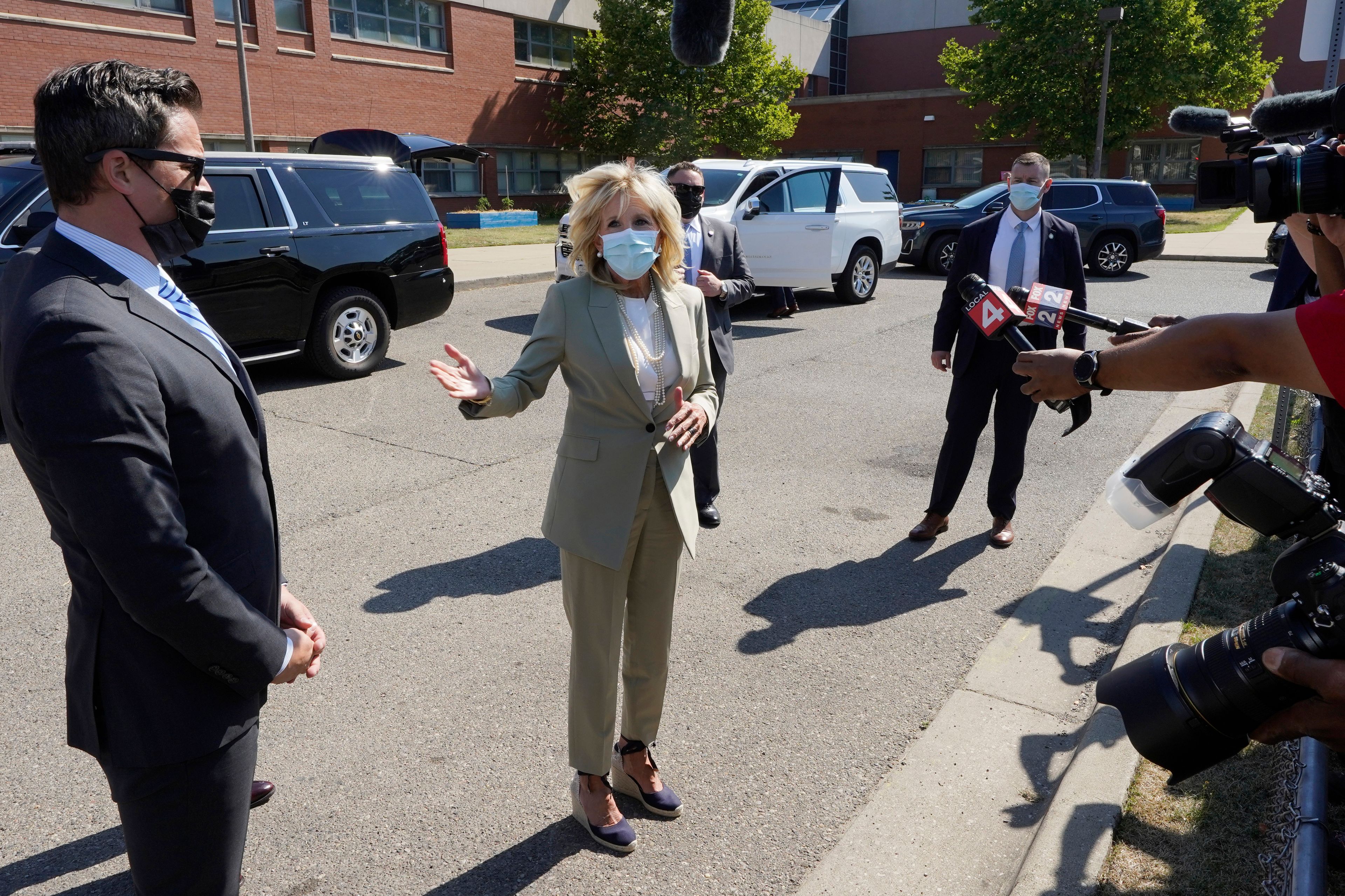 First lady Jill Biden speaks about President Joe Biden testing positive for COVID-19, as she arrives to visit Schulze Academy, Thursday, July 21, 2022, in Detroit. (AP Photo/Carlos Osorio)