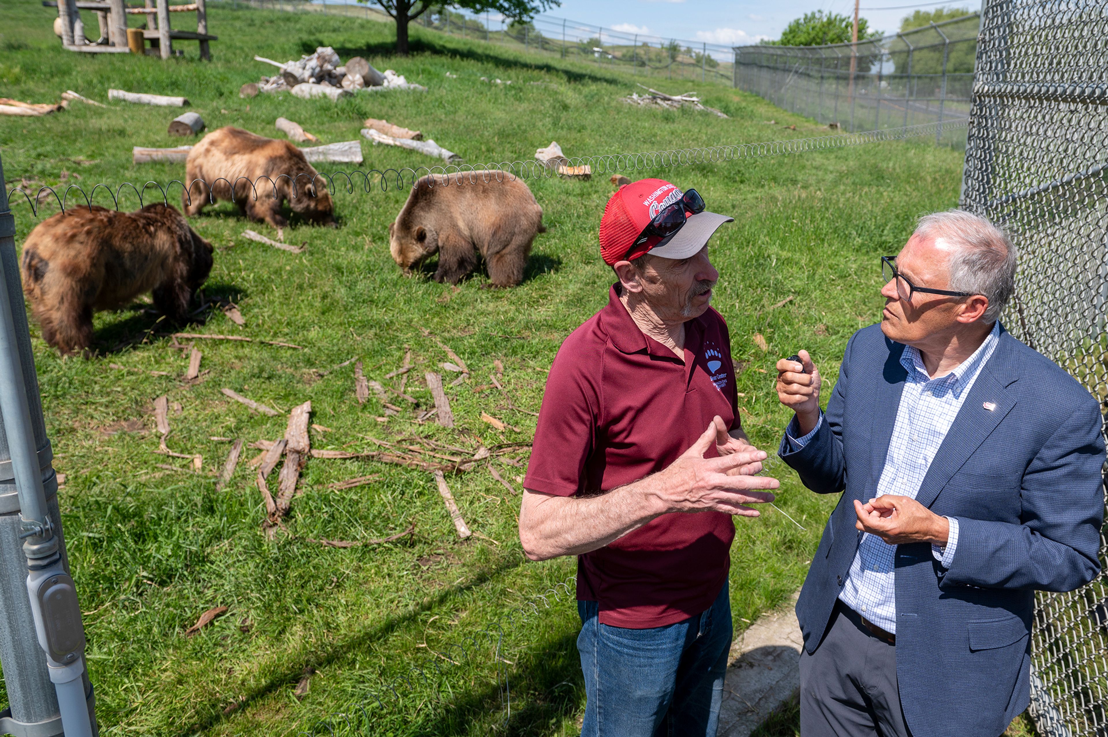 Washington Gov. Jay Inslee, right, speaks with professor Charlie Robbins while touring Washington State University’s Bear Center on Thursday afternoon in Pullman.