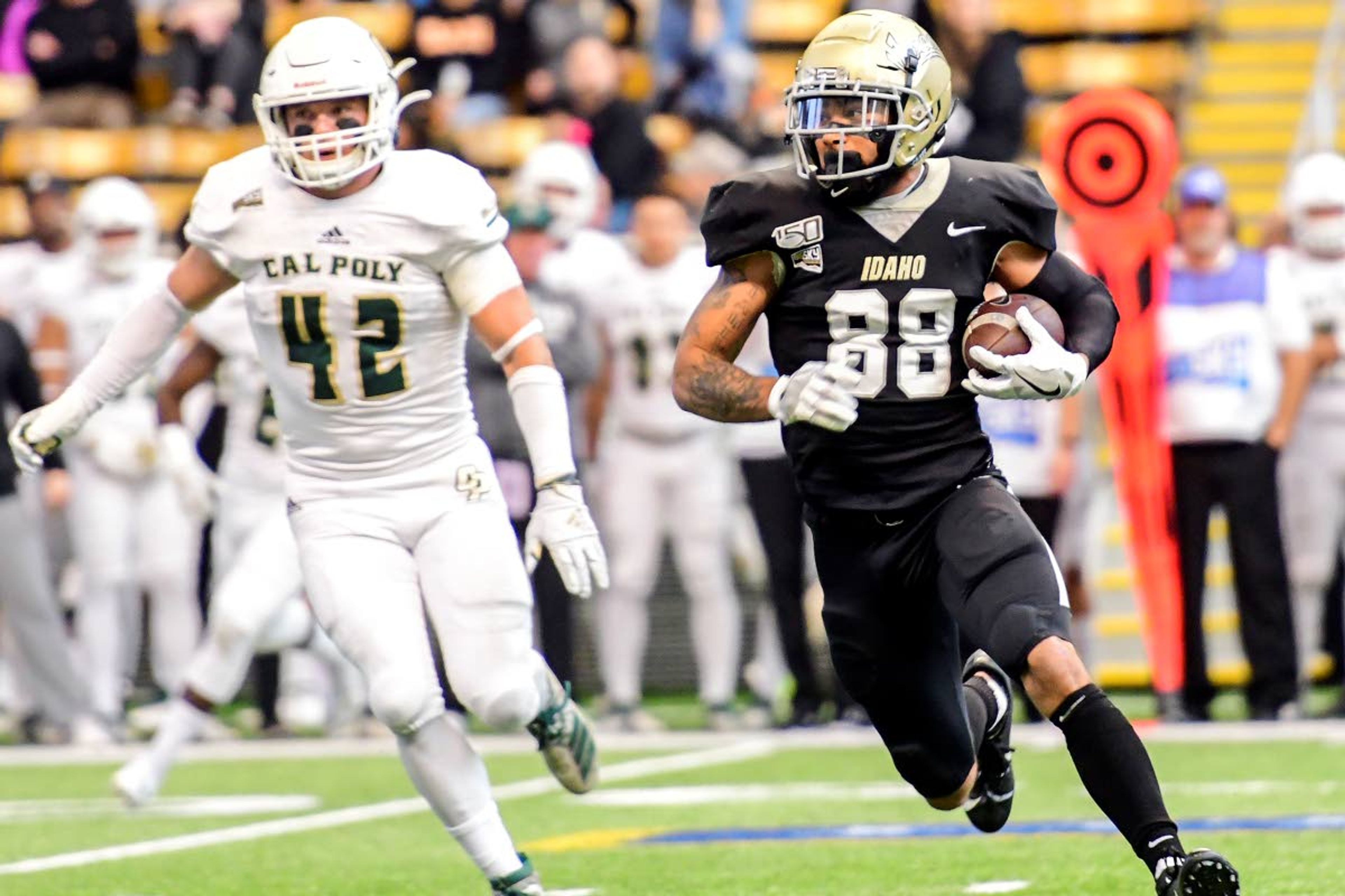 In this Nov. 2, 2019 file photo, Idaho receiver Jeff Cotton looks up field for extra yards after grabbing a pass from Mason Petrino during a Big Sky Conference game against Cal Poly at the Kibbie Dome in Moscow.