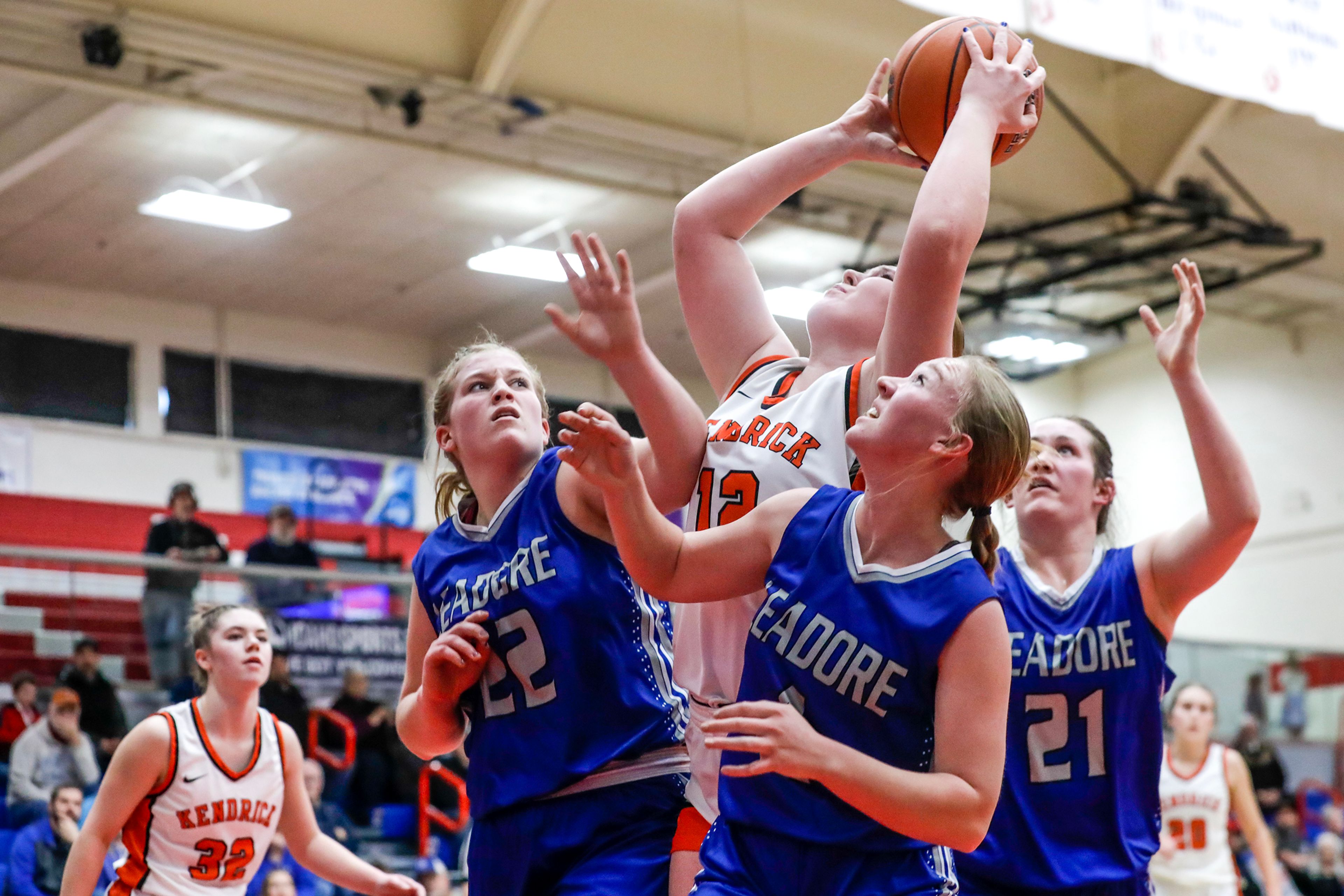 Kendrick post Natalie Kimbley shoots the ball as Leadore's Kalli Huston (22), Mesa Herbst and Lexi Bird guard her during a quarterfinal game in the girls 1A DII state tournament Thursday at Nampa High School in Nampa.