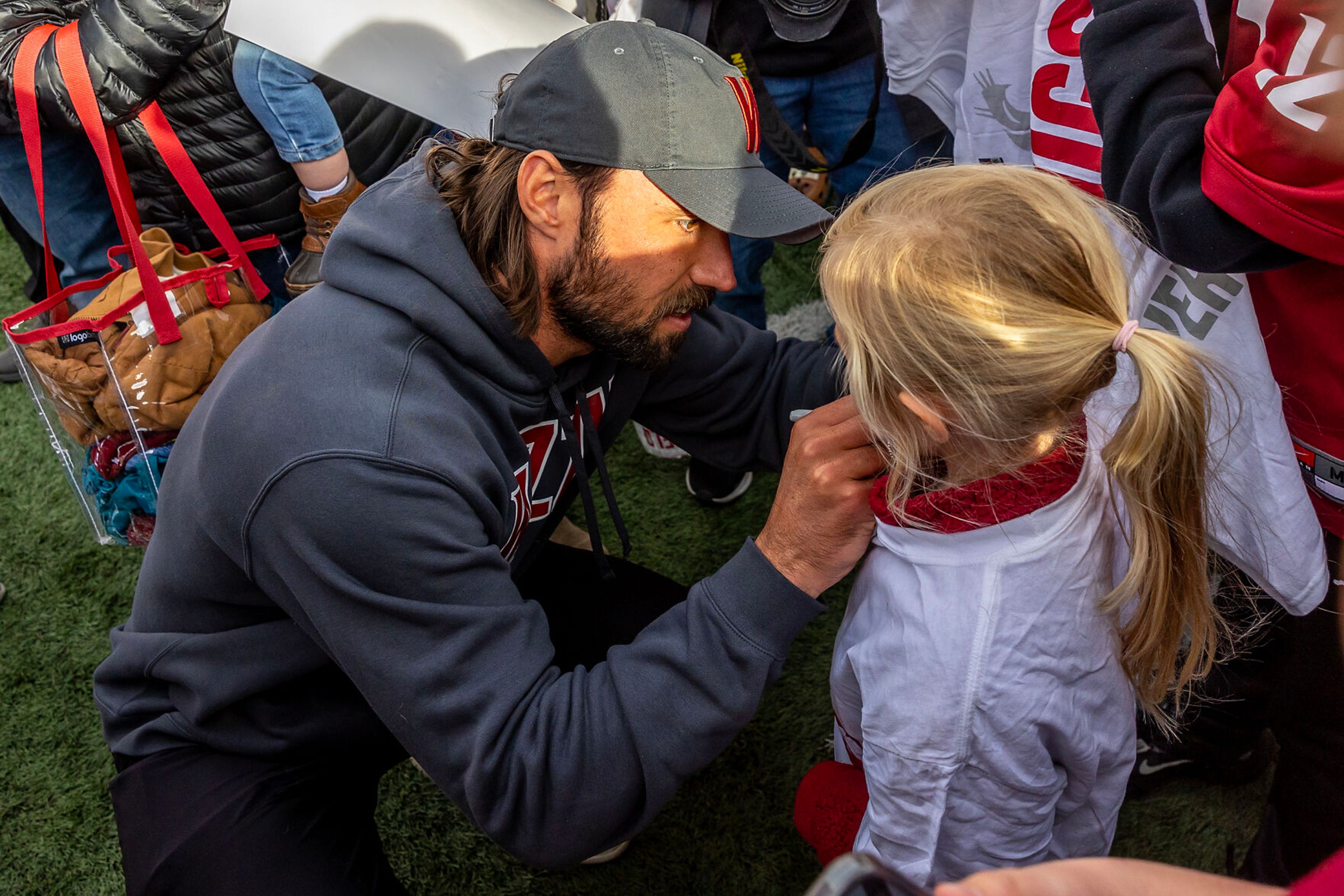 Former Cougar and current Las Vegas Raiders quarterback Gardner Minshew signs a shirt of a young fan after the Crimson and Gray Game at Washington State University in Pullman.