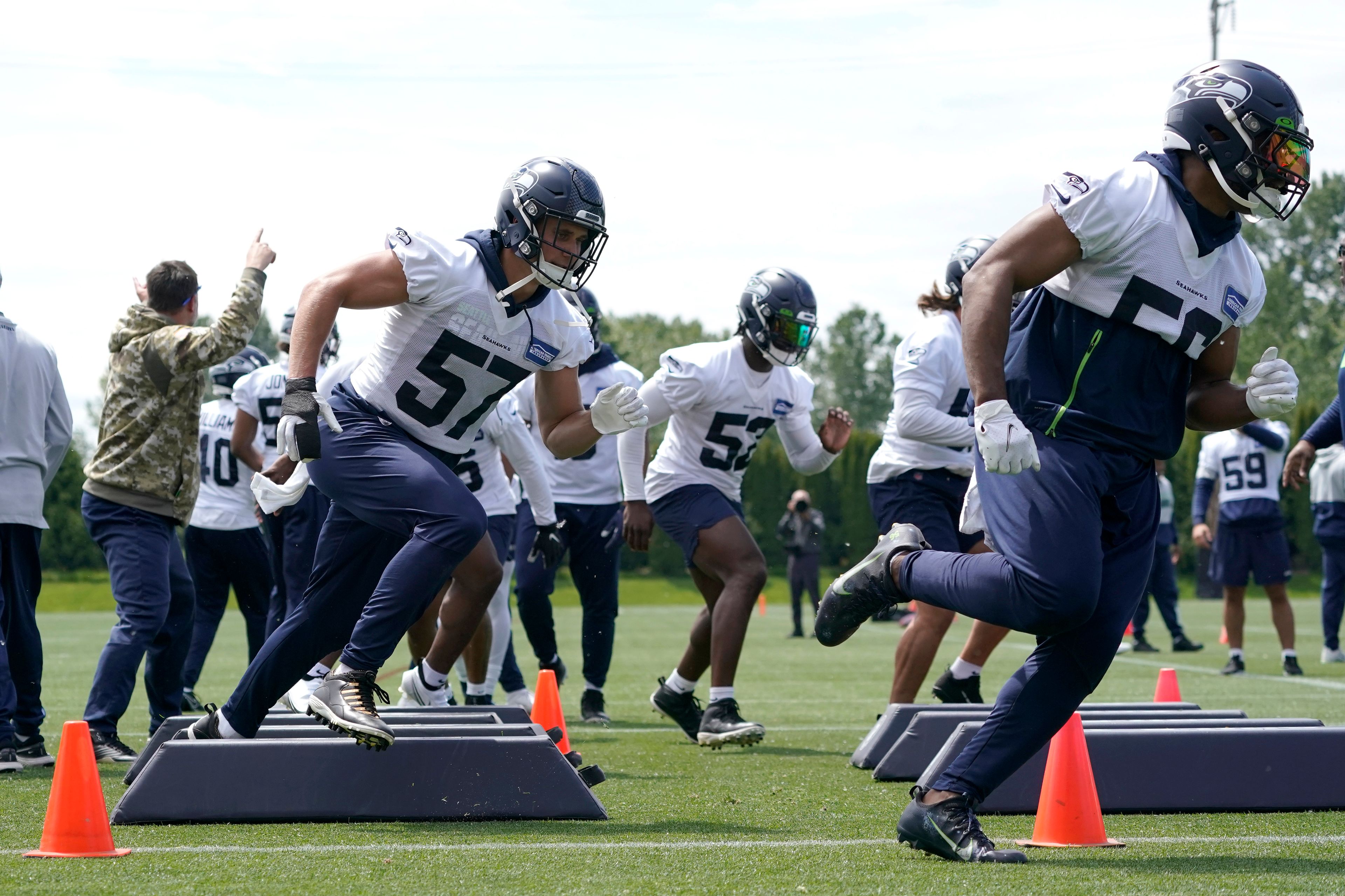 Associated PressSeahawks linebackers Cody Barton (57) and Jordyn Brooks, right, run a drill during NFL football practice Monday in Renton, Wash. Brooks is being looked to as a leadership replacement on the defensive side of the ball, after longtime linebacker Bobby Wagner signed with the Rams.