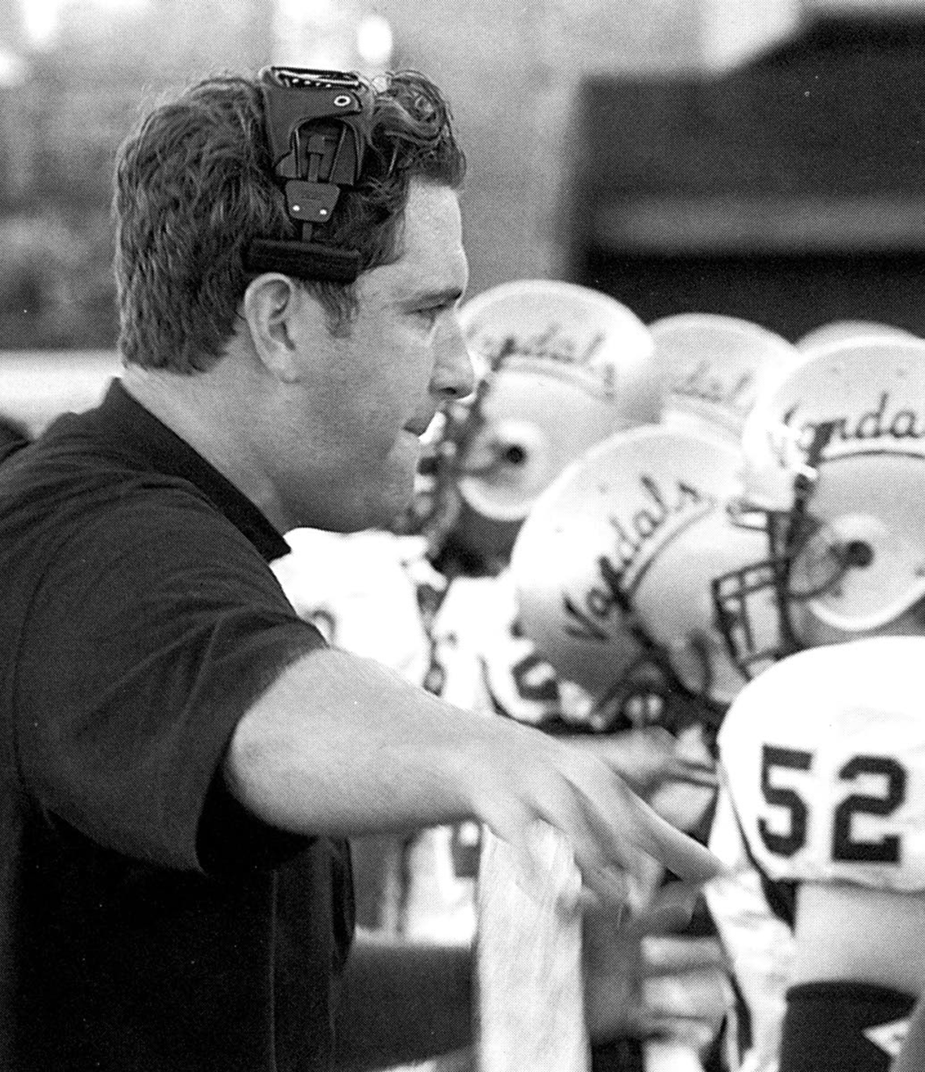 Jason Eck coaches the Idaho offensive linemen during a 2004 game.