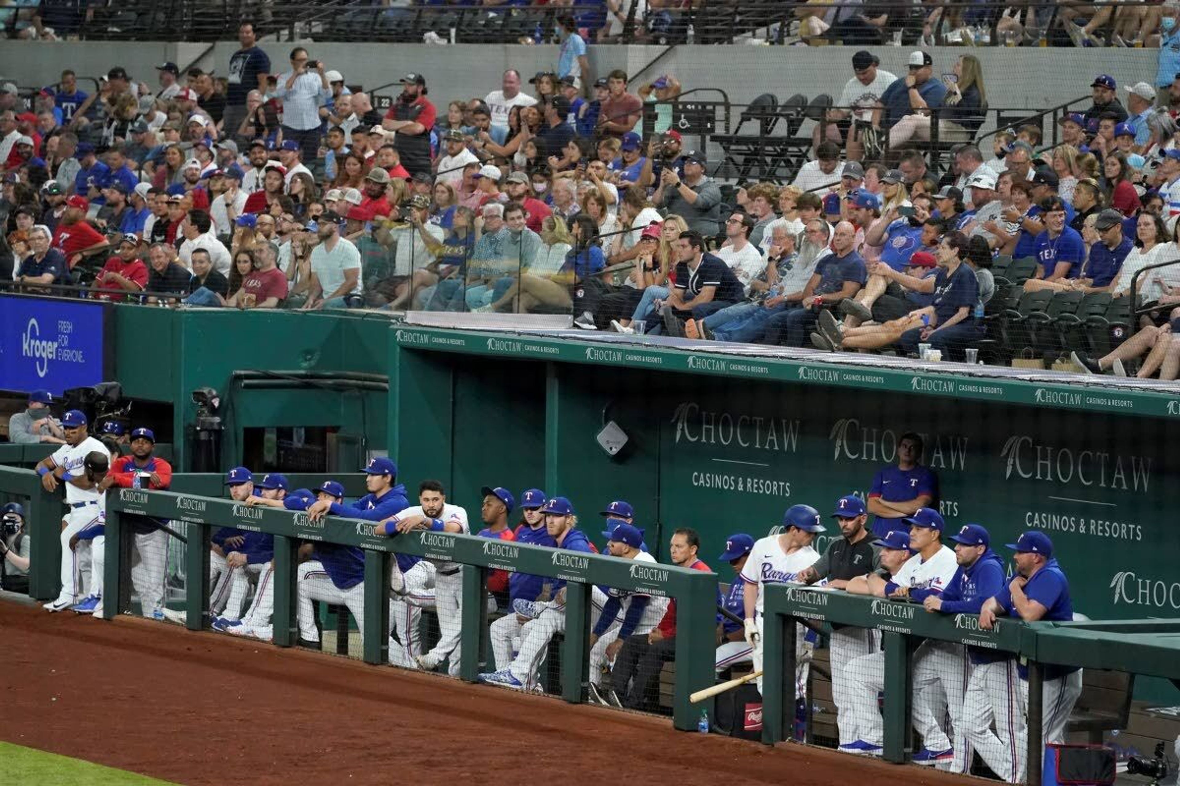 Fans and Texas Rangers watch as New York Yankees' Corey Kluber throws in the ninth inning of a baseball game in Arlington, Texas, Wednesday, May 19, 2021. Kluber no-hit the Rangers in the Yankees' 2-0 win. (AP Photo/Tony Gutierrez)