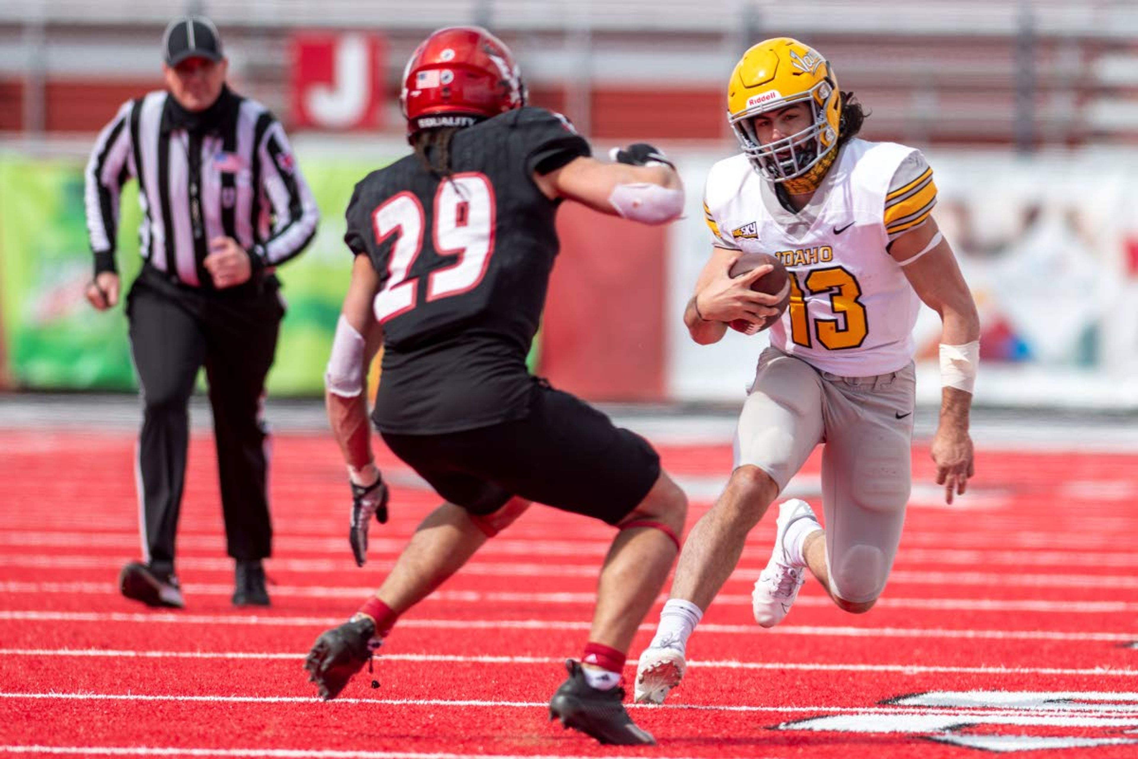 Idaho quarterback Zach Borisch, right, prepares to cut as Eastern Washington defensive back Anthany Smith breaks down to attempt a tackle Saturday at Roos Field in Cheney, Wash. Borisch impressed in the 38-31 Idaho loss, his first career start at quarterback.