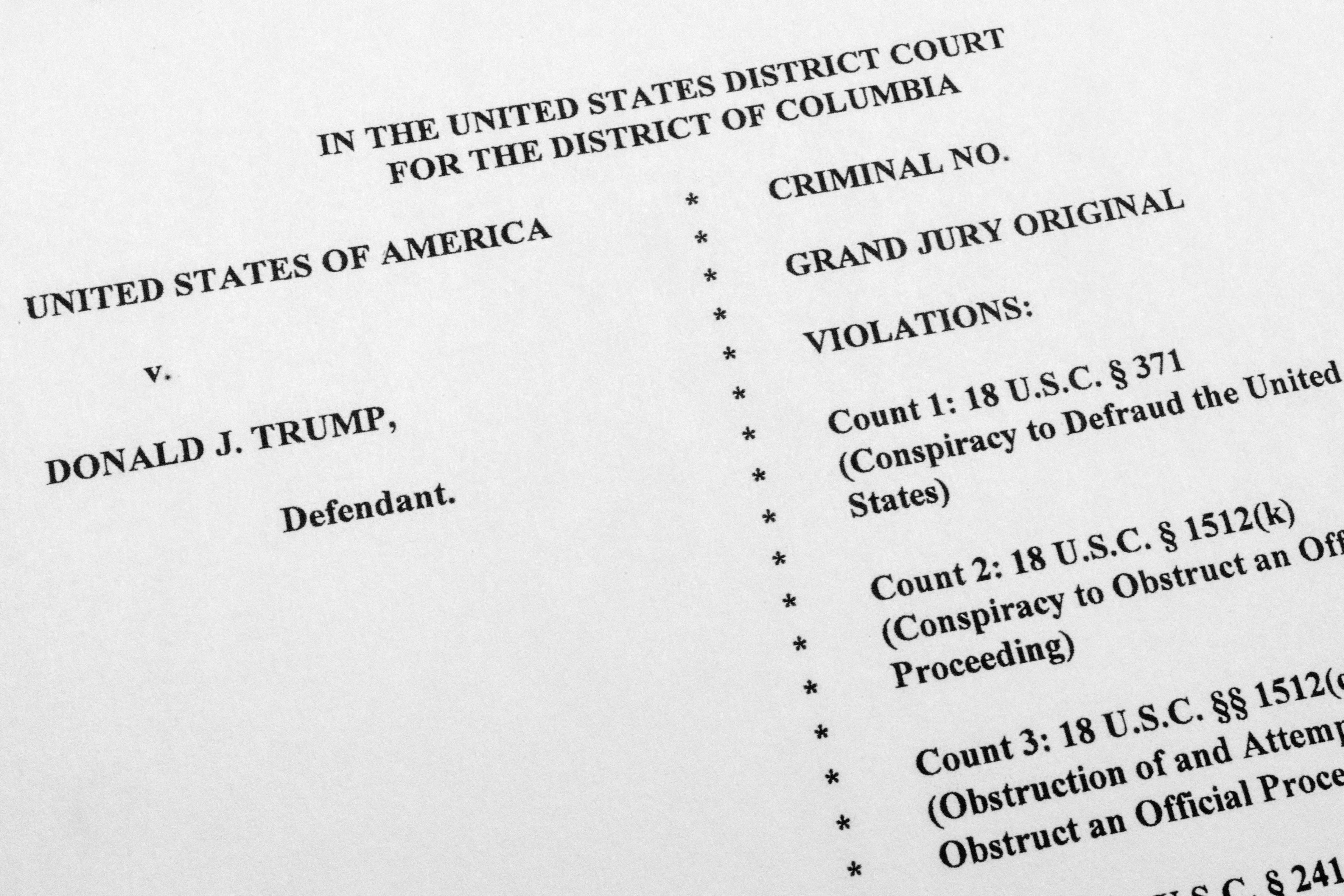 The indictment against former President Donald Trump charging him by the Justice Department for his efforts to overturn the results of the 2020 presidential election, is photographed Tuesday, Aug. 1, 2023, in Washington. (AP Photo/Jon Elswick)