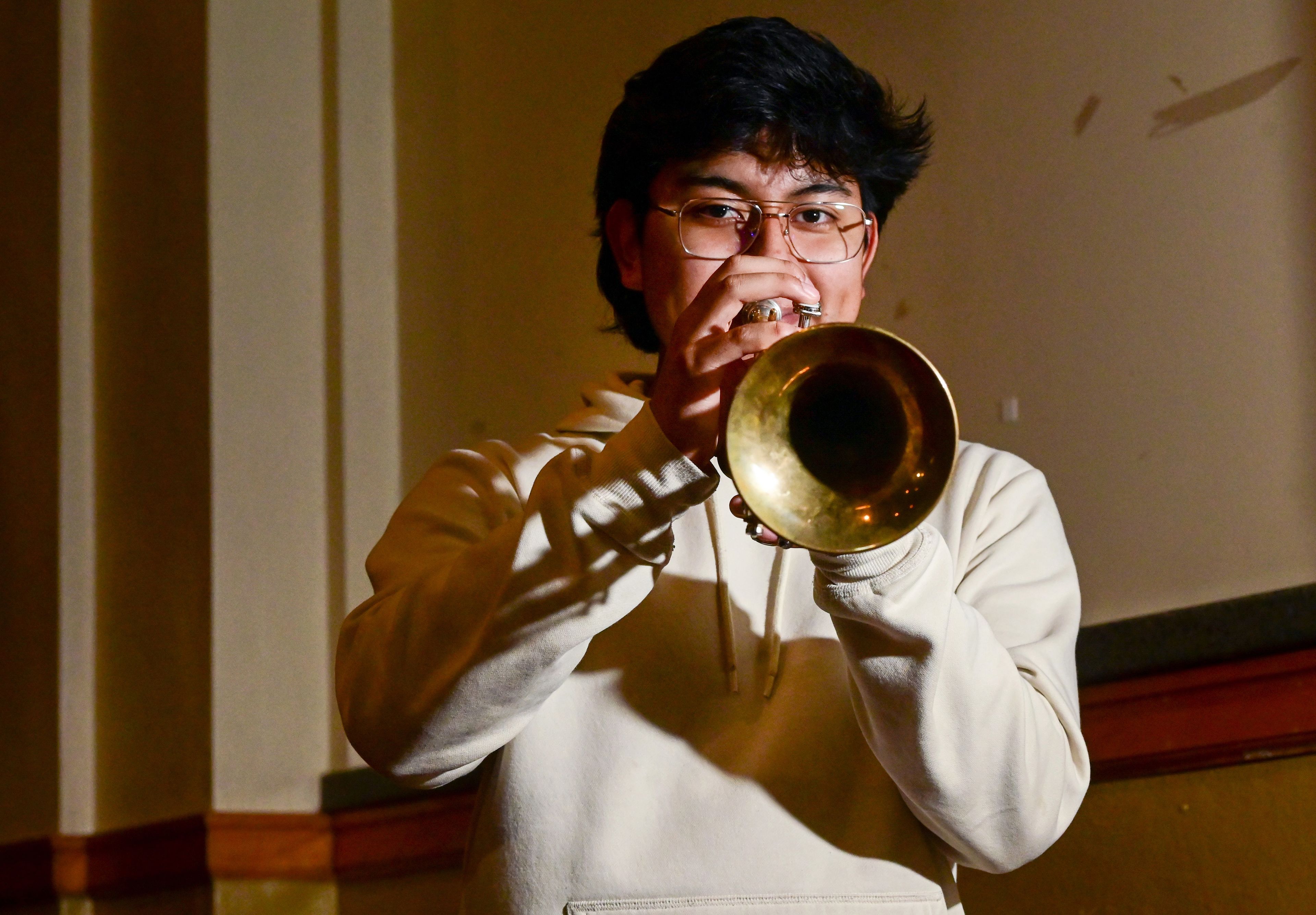 Moscow High School junior James McKinley holds his trumpet in the auditorium at the school on Wednesday. McKinley was selected to play in the 2024 All-American D-Day Band, which will perform in Paris and Normandy.