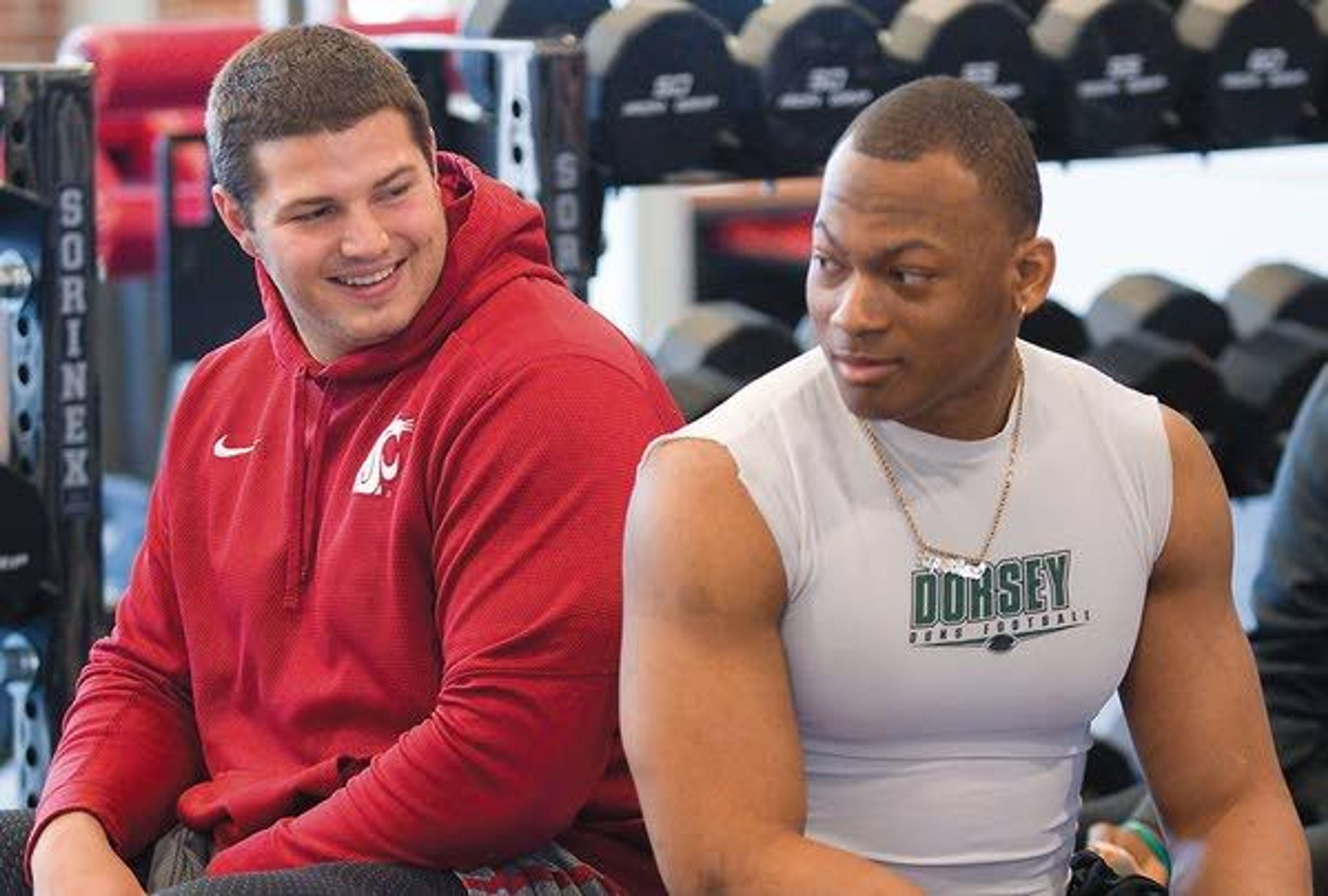 Washington State’s Joe Dahl, left, and Jeremiah Allison talk before working for pro scouts on Thursday in Pullman.