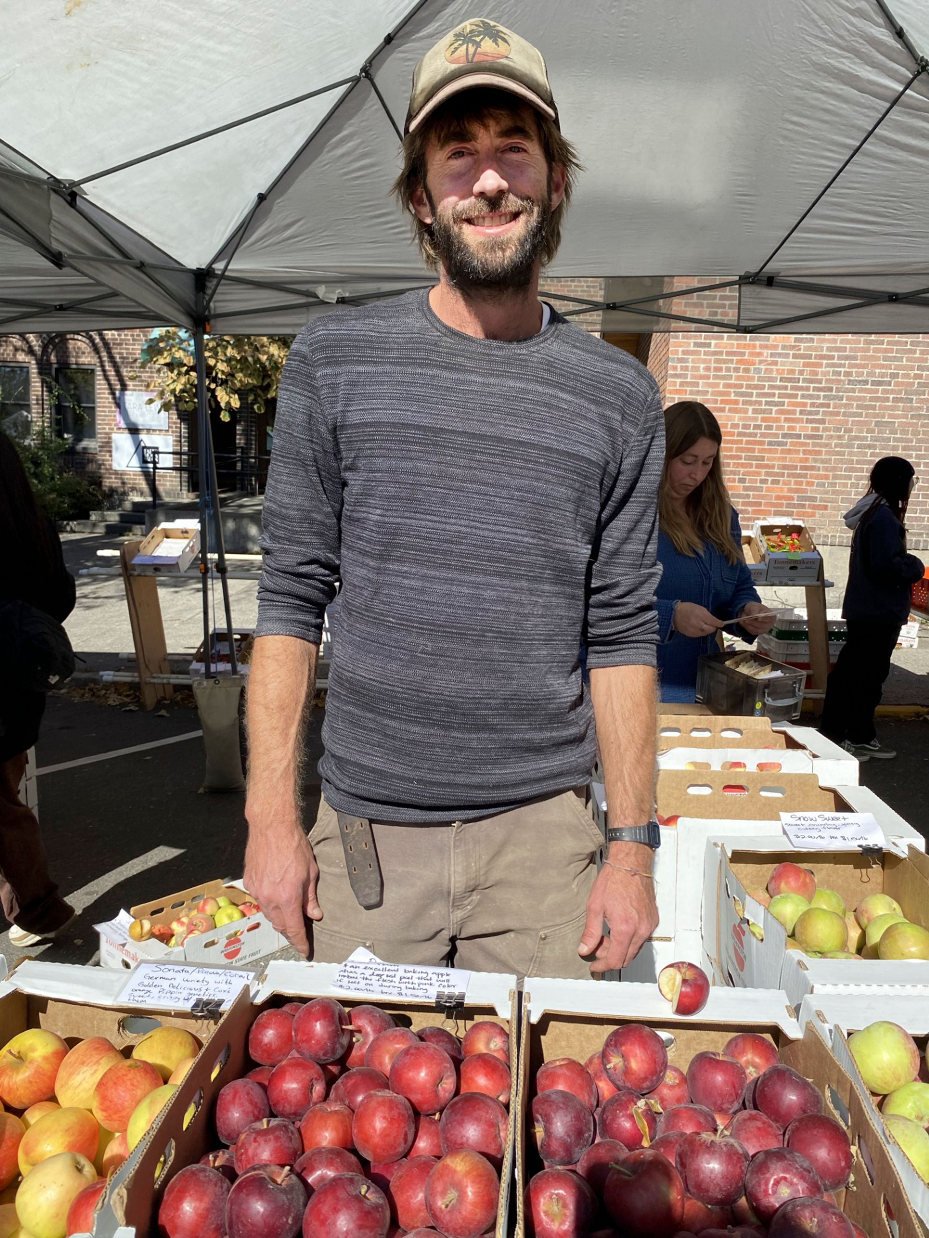 Chaz Petersen, shown working the Tonnemaker Family Farm booth at Saturday’s Moscow Farmers Market, voted apple.