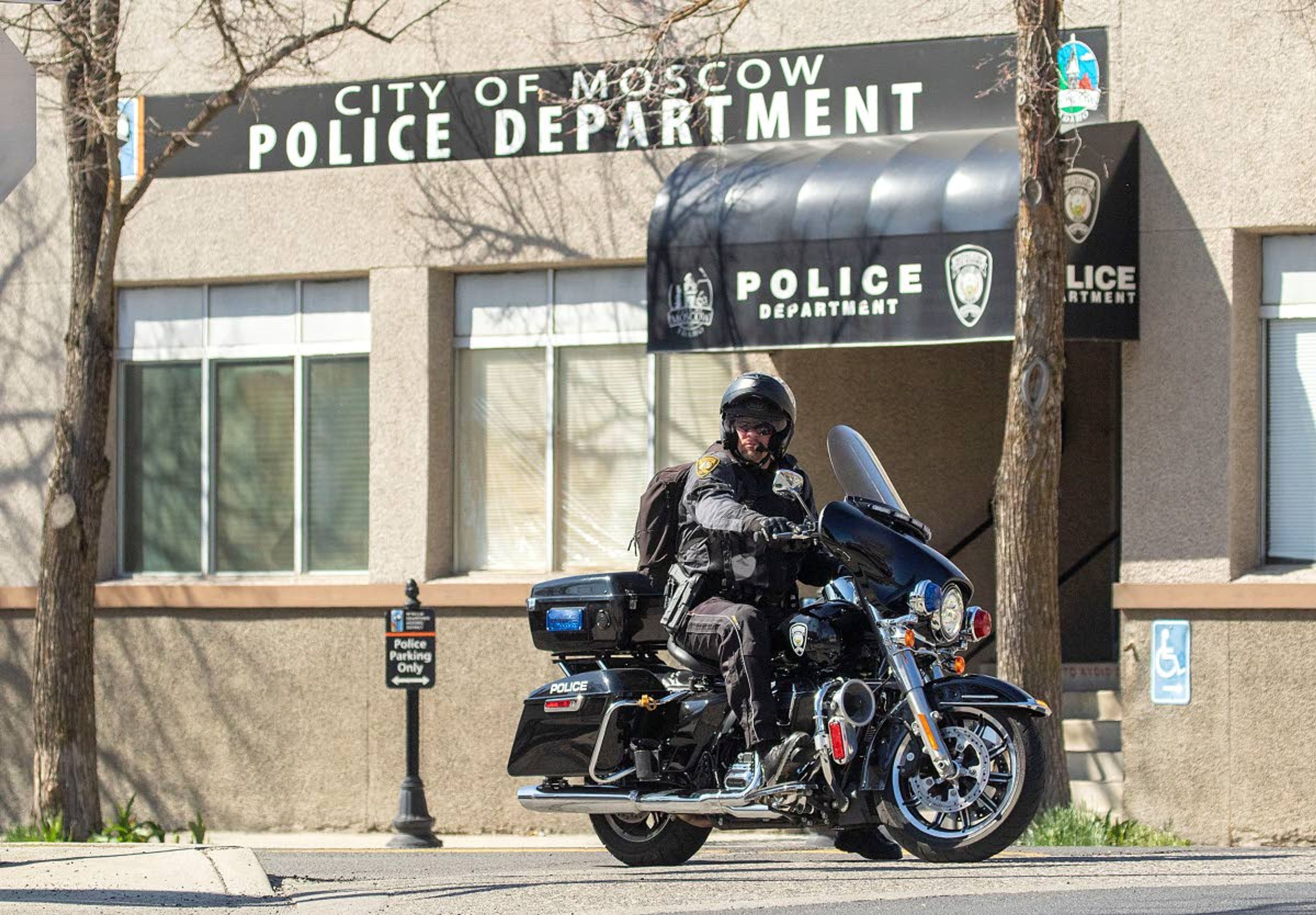 In this 2020 photo, a Moscow police officer leaves the police station to patrol on a motorcycle. The University of Idaho has indicated it’s interested in buying the building, which will be vacated in October.