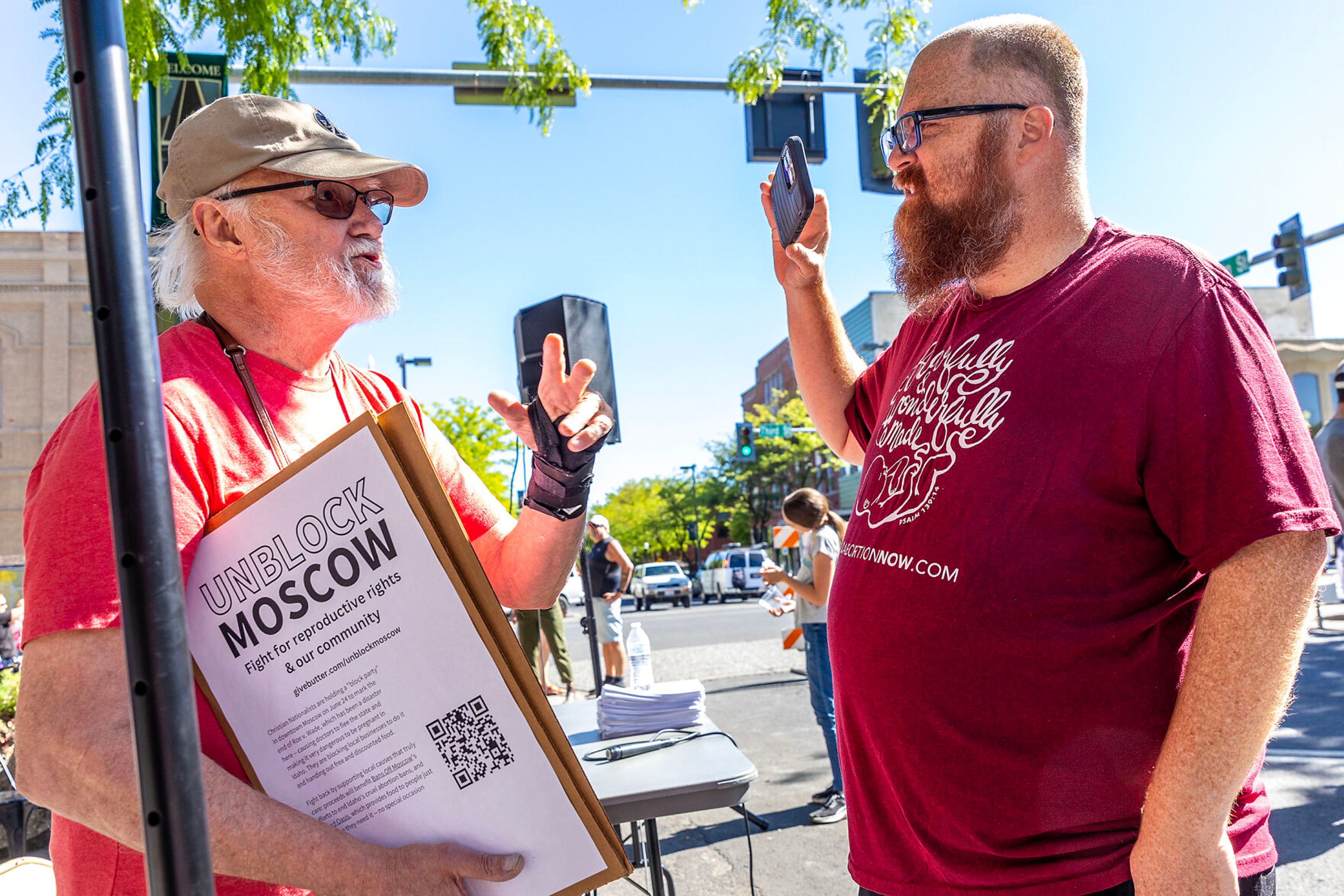 People argue with each other as one side celebrates the anniversary of the overturning of Roe v. Wade with a block party on Main Street Monday in Moscow.