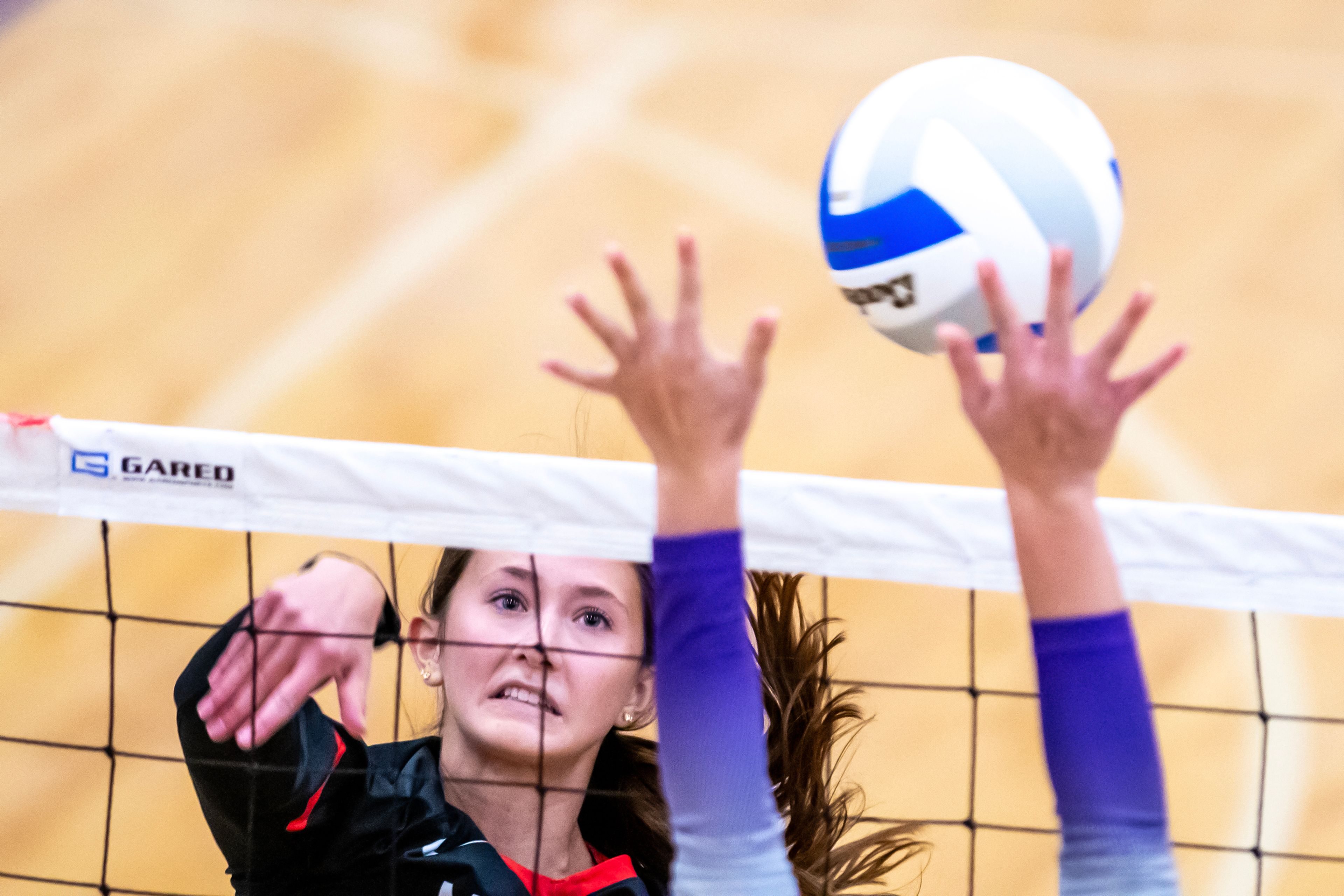 Moscow middle Taylor McLuen spikes the ball against Lewiston in a 5A district tournament match Tuesday in Lewiston.