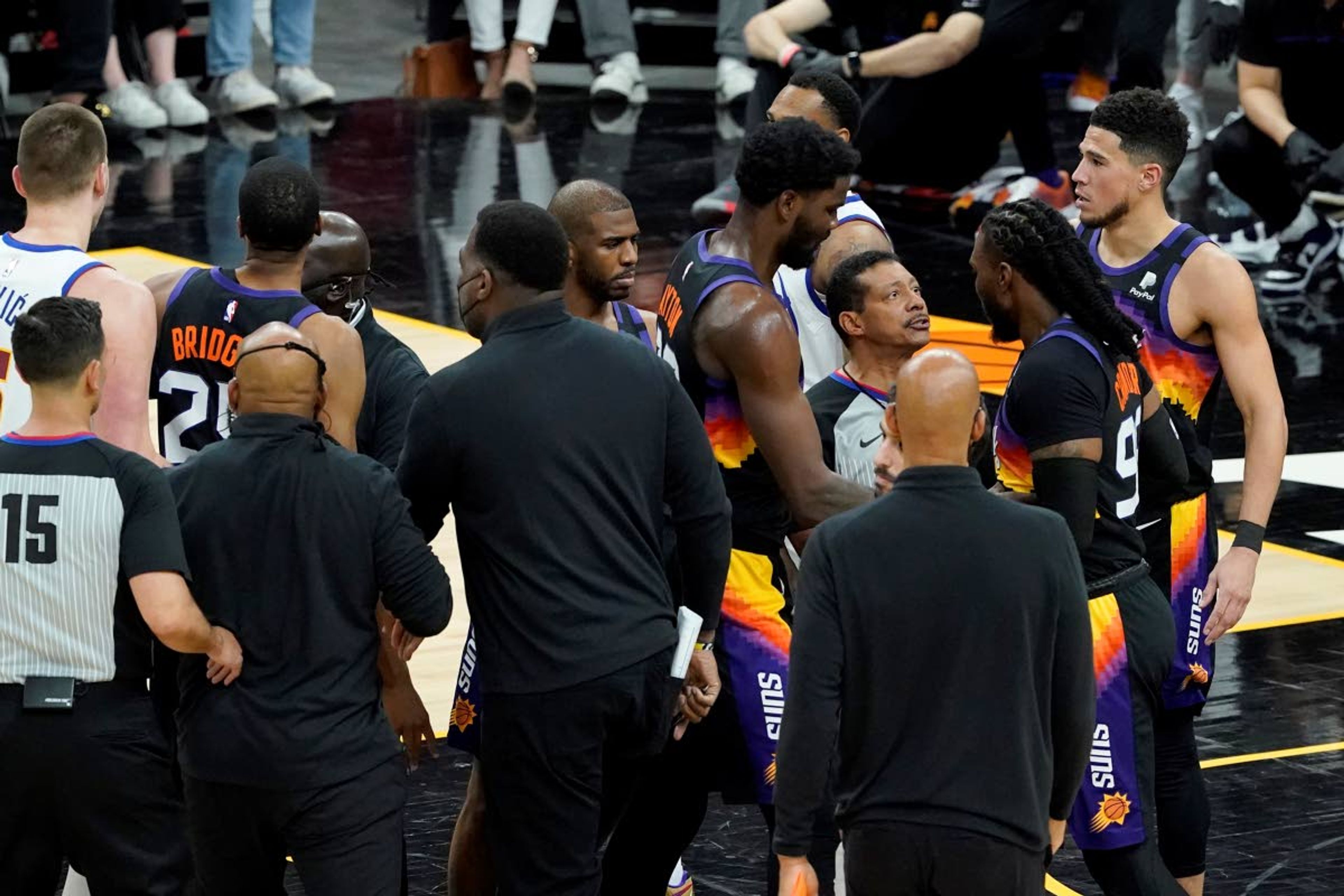 Officials separate Phoenix Suns players and Denver Nuggets players during the second half of Game 2 of an NBA basketball second-round playoff series, Wednesday, June 9, 2021, in Phoenix. (AP Photo/Matt York)