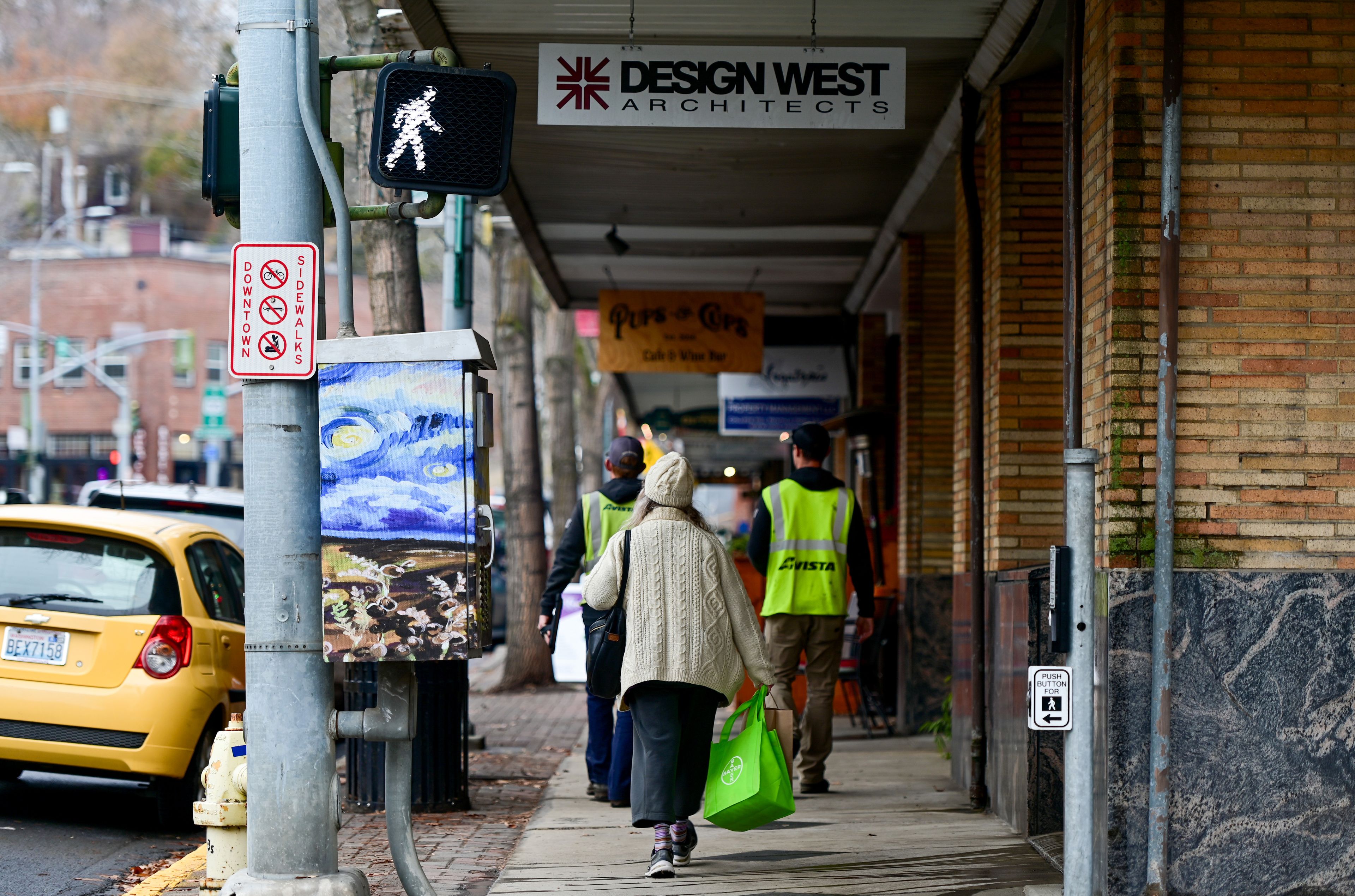 Pedestrians walk between shops and restaurants in downtown Pullman on Wednesday, Nov. 15.