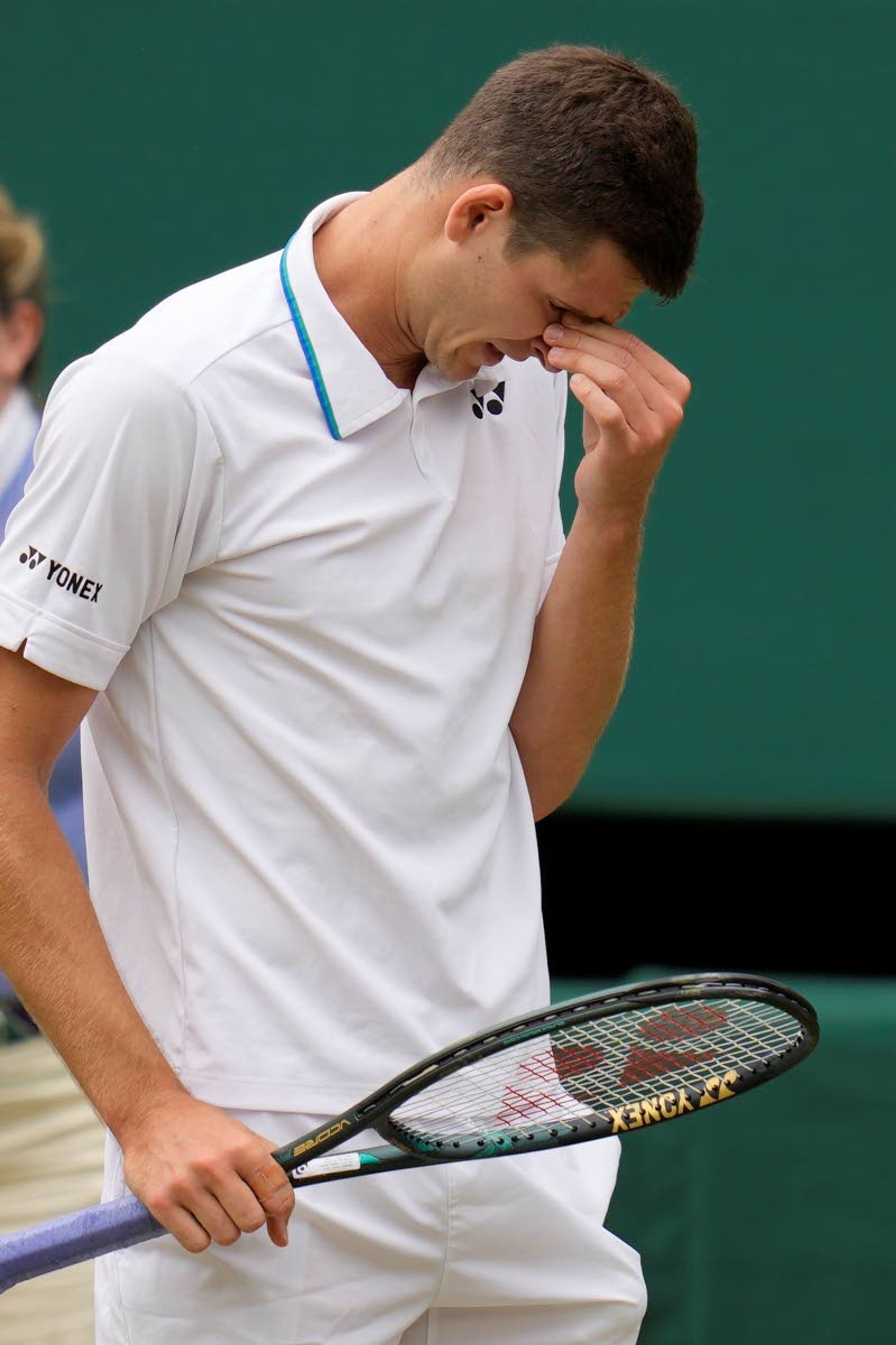 Poland's Hubert Hurkacz reacts after losing a point to Italy's Matteo Berrettini during the men's singles semifinals match on day eleven of the Wimbledon Tennis Championships in London, Friday, July 9, 2021. (AP Photo/Kirsty Wigglesworth)