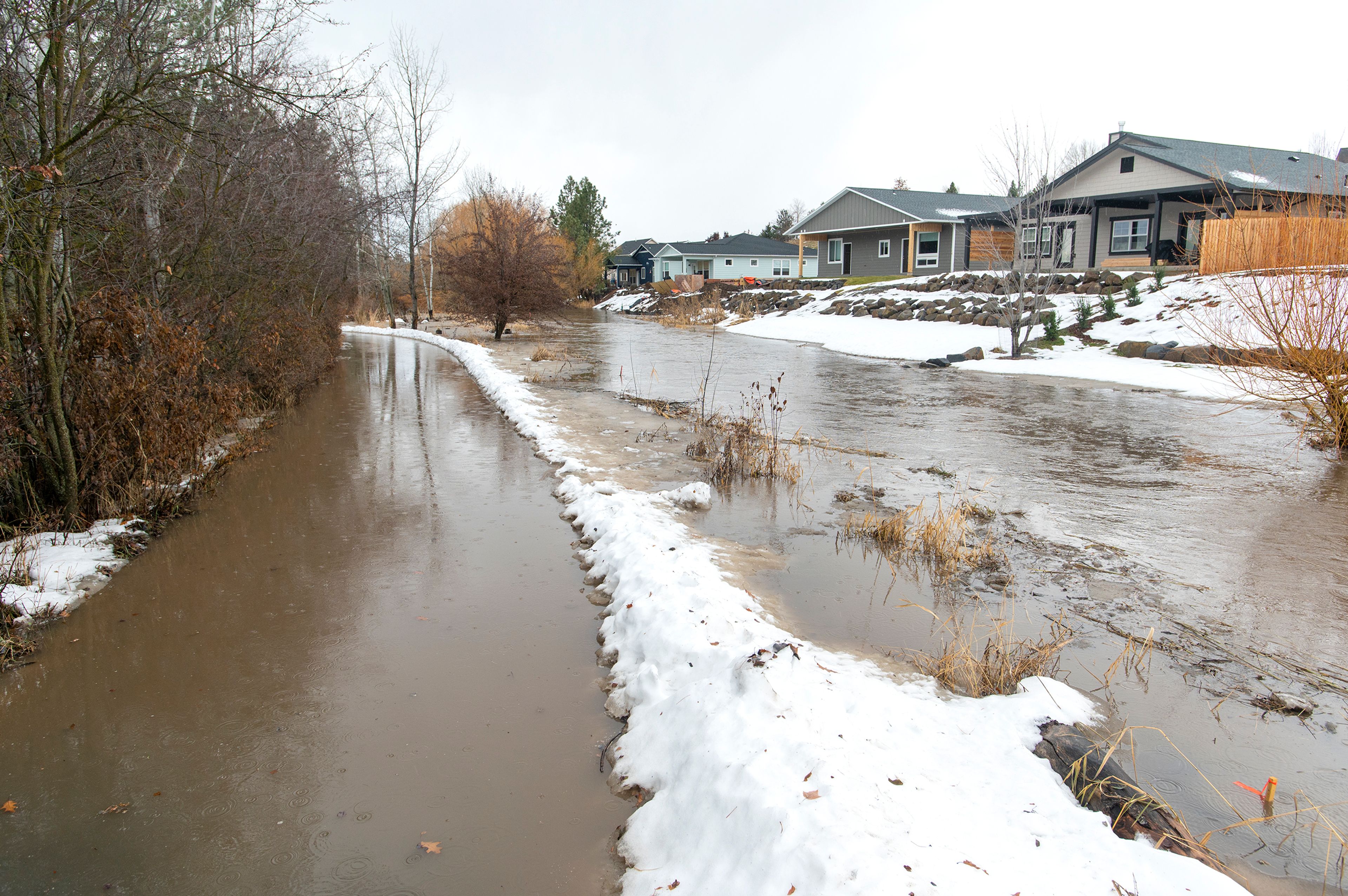 Paradise Creek floods a pathway at the Carol Ryrie Brink Nature Park in Moscow on Tuesday.