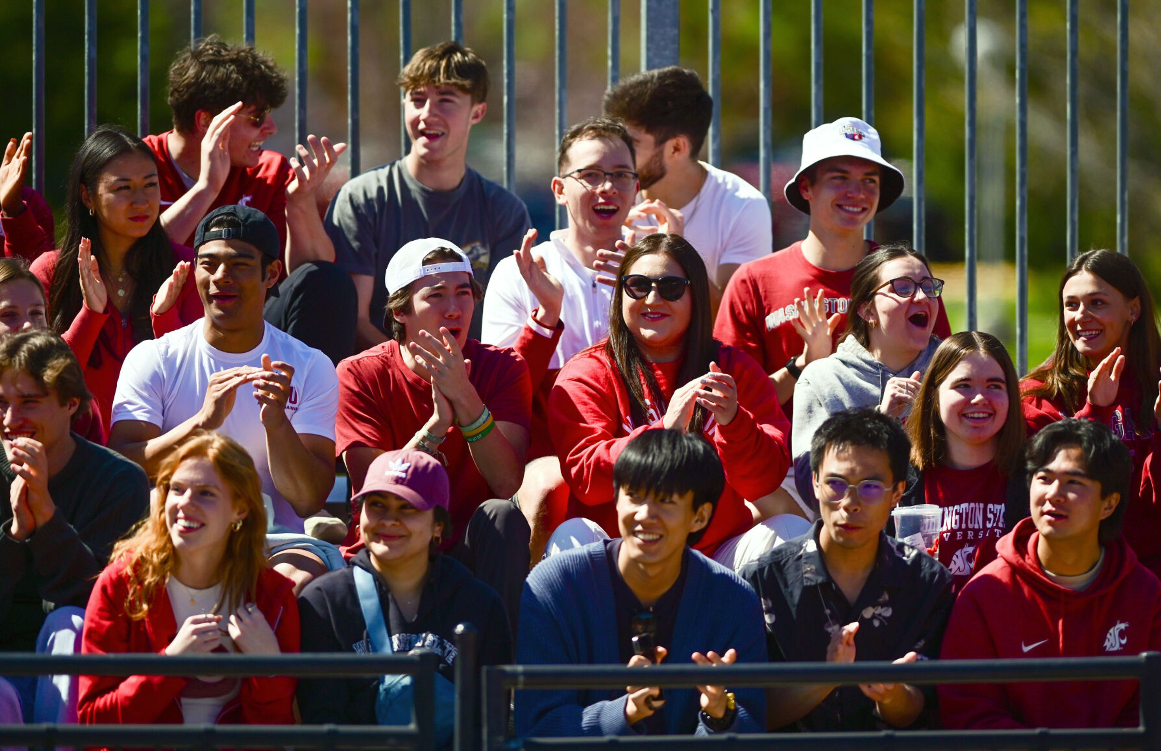 Washington State fans cheer for the women’s tennis team as they play Washington in Pullman on Friday.