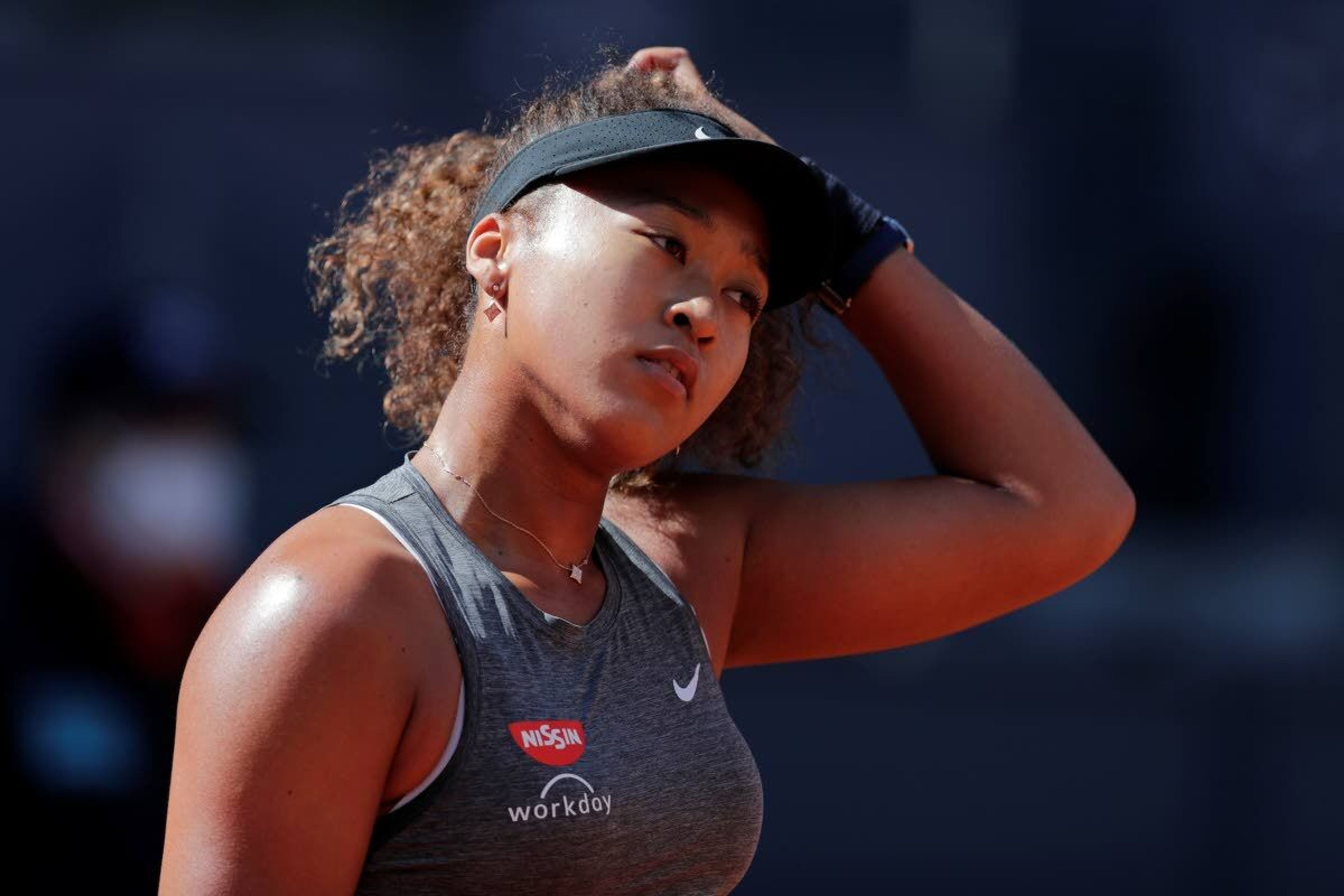 Naomi Osaka of Japan reacts during her match against Karolina Muchova of the Czech Republic during their match at the Madrid Open tennis tournament in Madrid, Spain, Sunday, May 2, 2021. (AP Photo/Paul White)